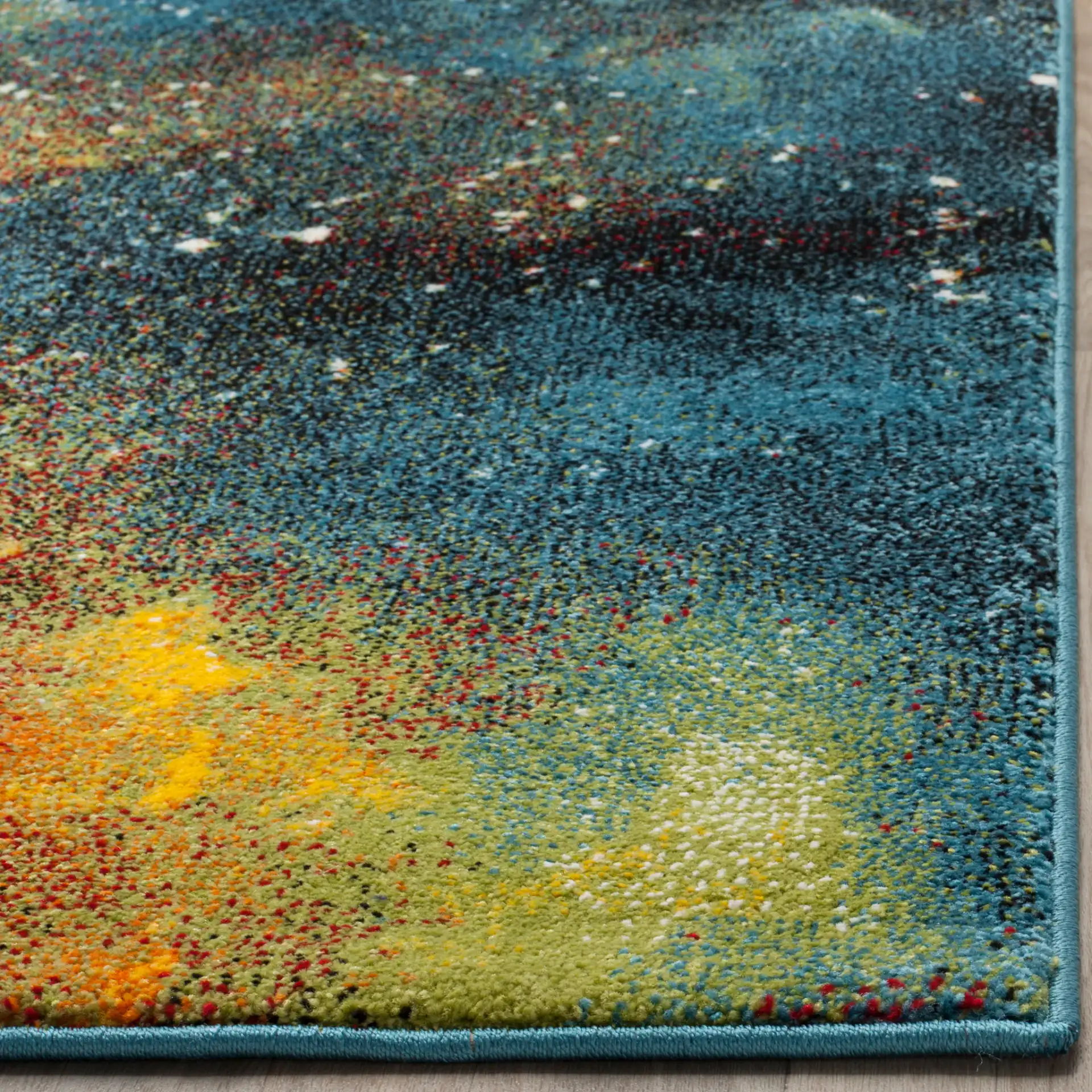 Galaxy Abstract Painterly Rug in Blue / Multicolor in a styled room