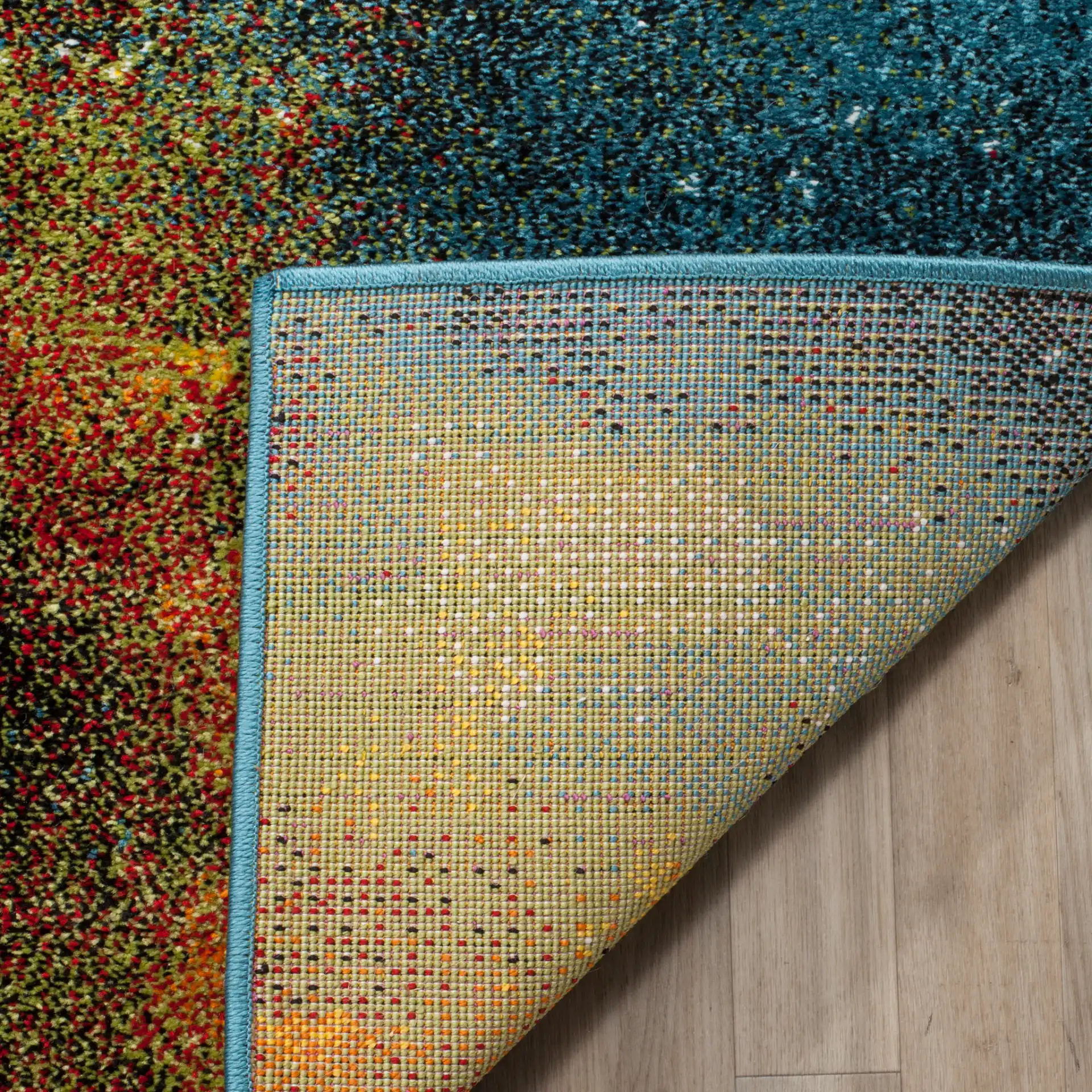Galaxy Abstract Painterly Rug in Blue / Multicolor in a styled room