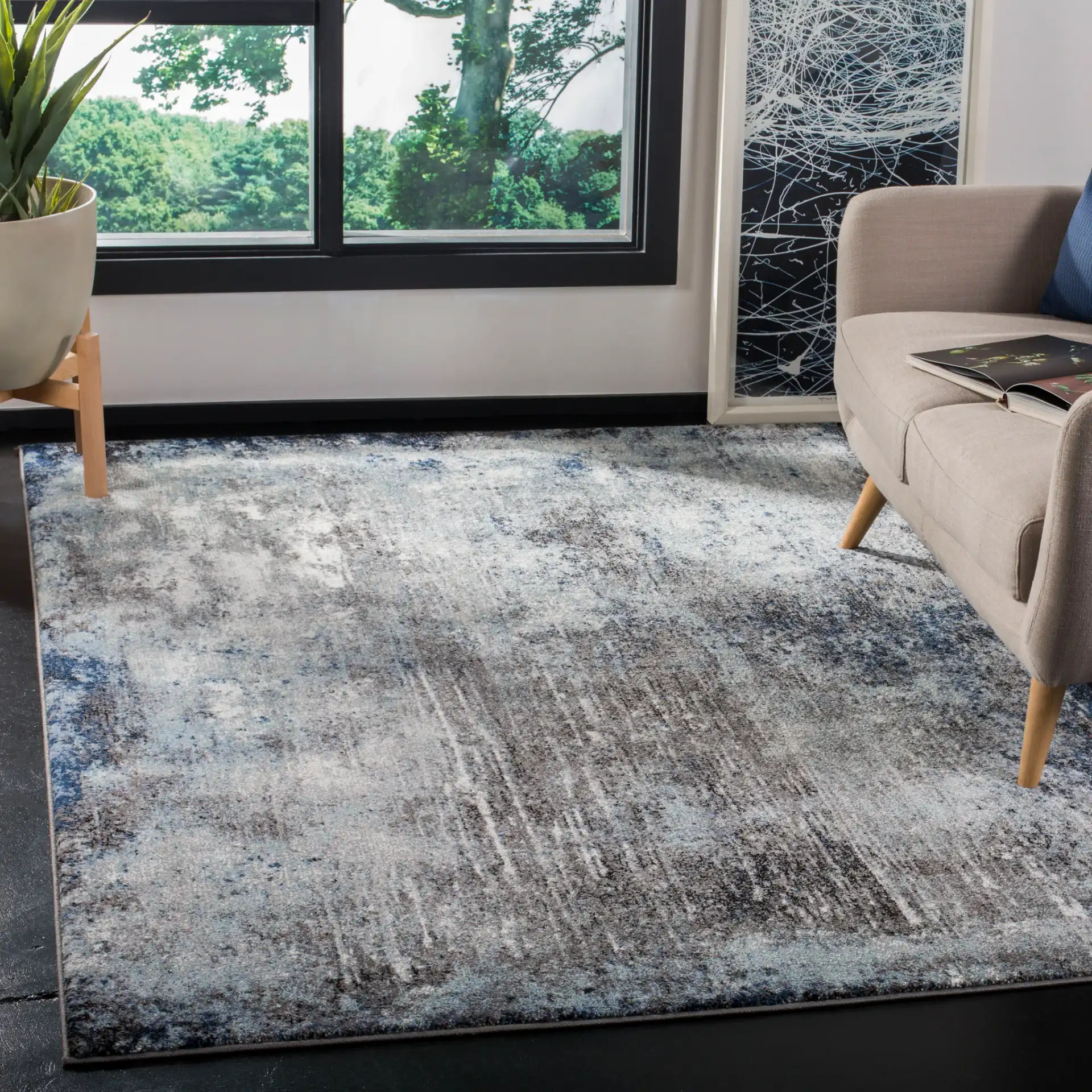 Galaxy Striated Abstract Rug in Charcoal / Blue in a styled room
