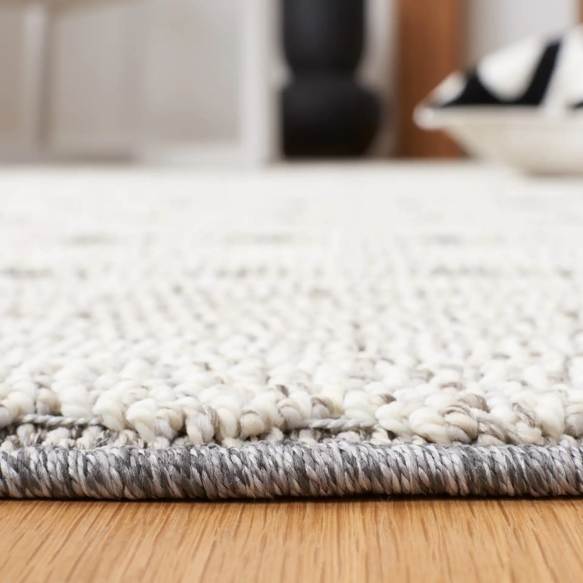 Global Bordered Diamond Rug in Light Gray / Dark Gray in a styled room