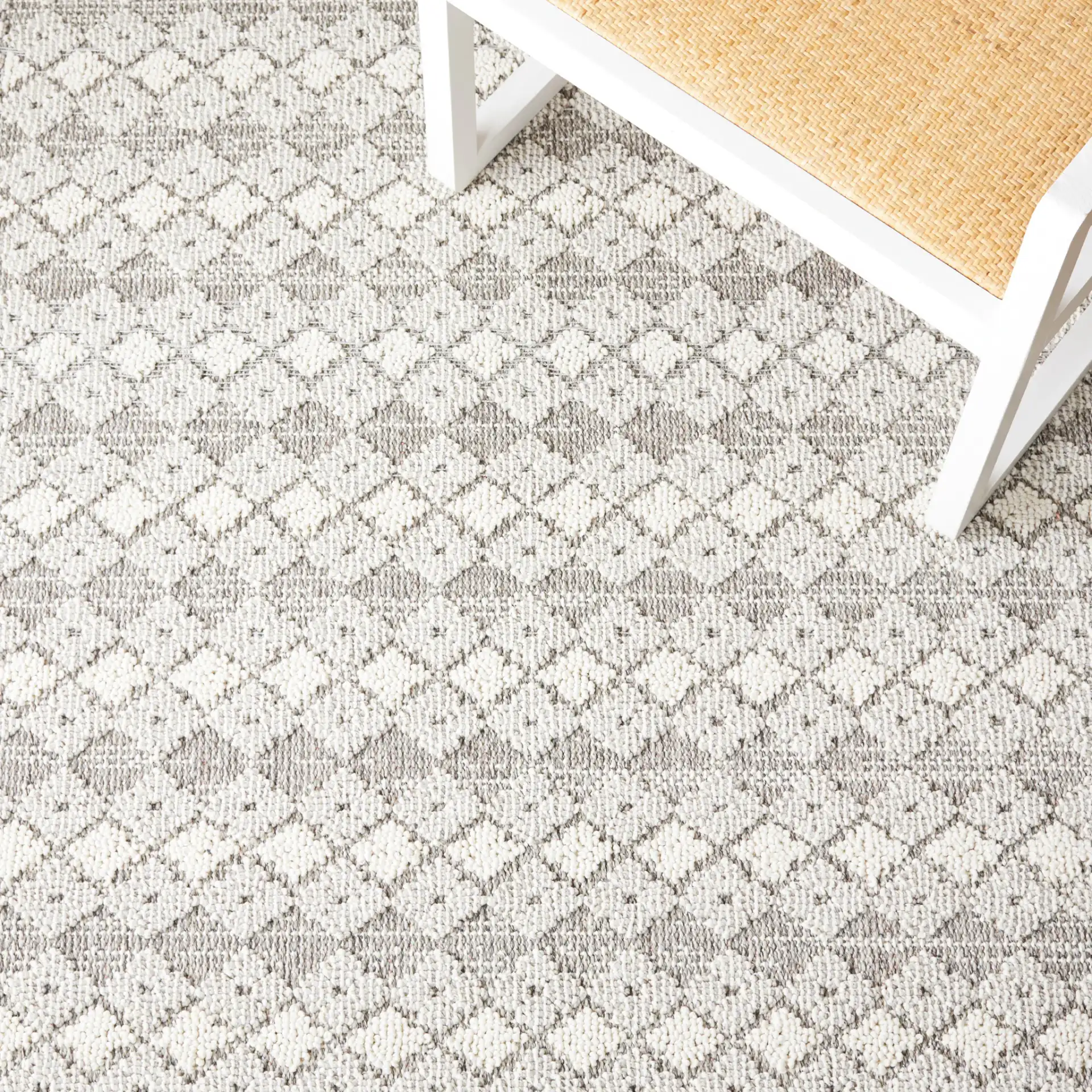 Global Bordered Diamond Rug in Light Gray / Dark Gray in a styled room