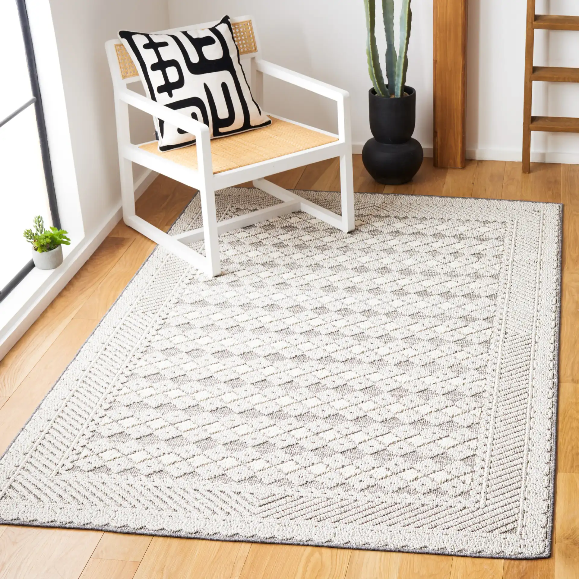 Global Bordered Diamond Rug in Light Gray / Dark Gray in a styled room
