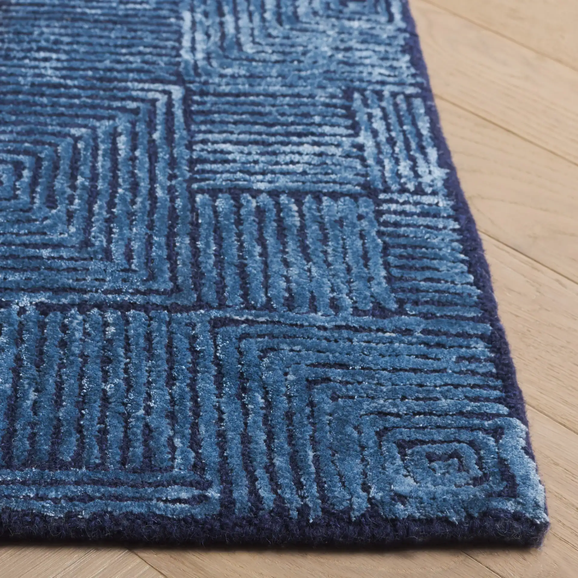 Glamour Concentric Squares Hand-Tufted Rug in Navy in a styled room