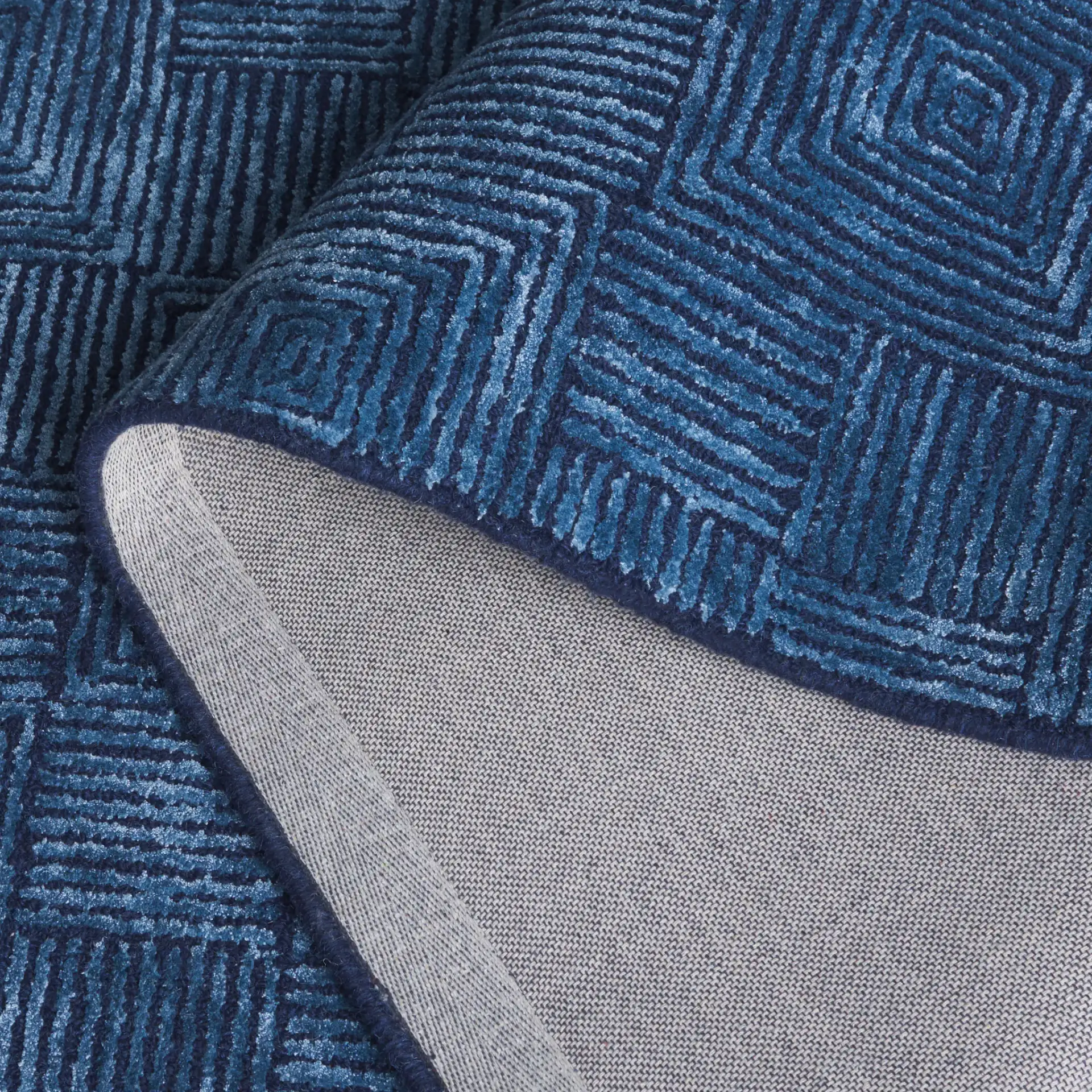 Glamour Concentric Squares Hand-Tufted Rug in Navy in a styled room