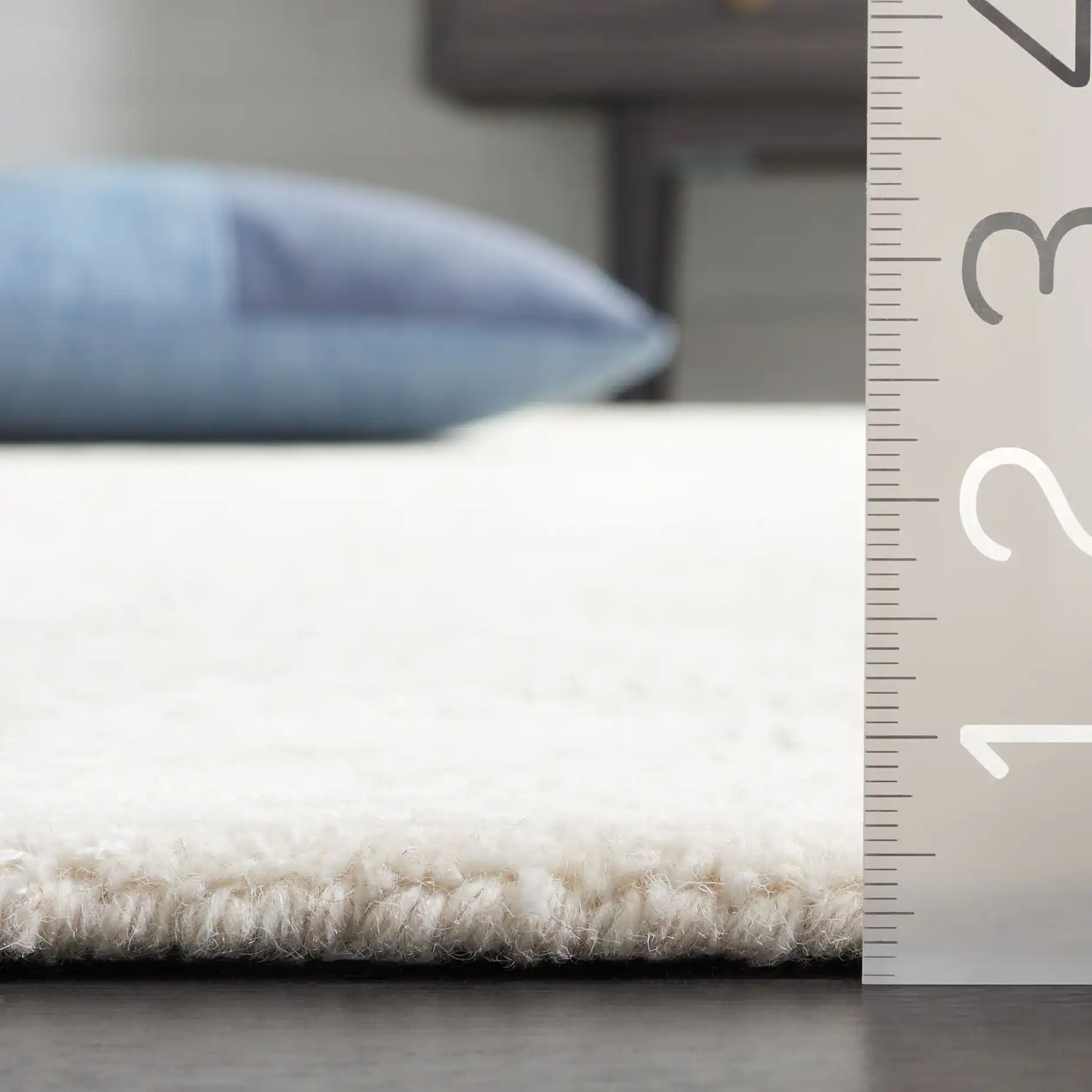 Glamour Wavy Stripe Hand-Tufted Rug in Ivory in a styled room