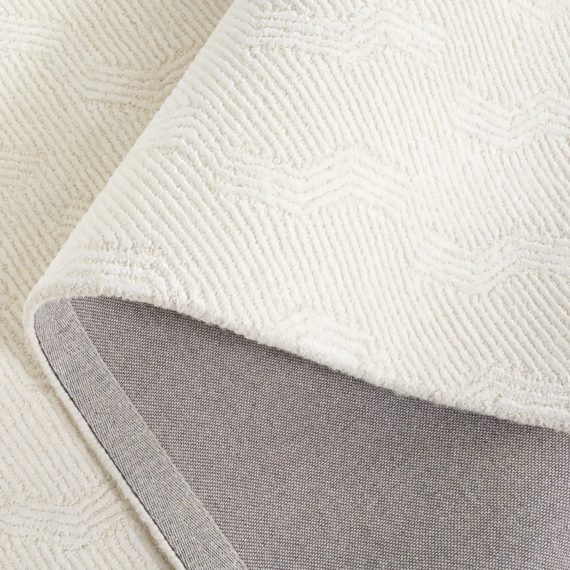 Glamour Wavy Stripe Hand-Tufted Rug in Ivory in a styled room