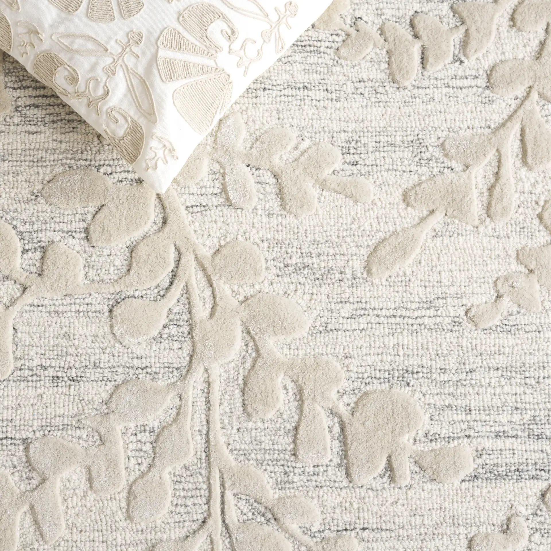 Glamour Eucalyptus Vine Hand-Tufted Rug in Natural / Gray in a styled room