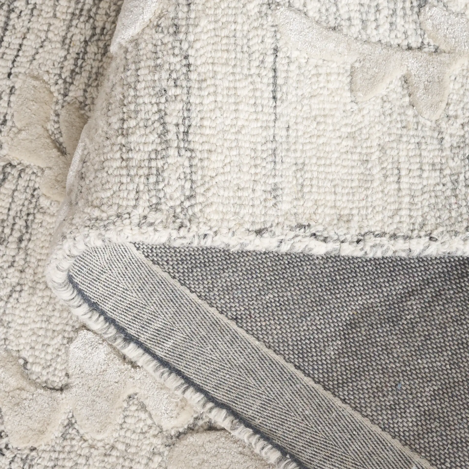 Glamour Eucalyptus Vine Hand-Tufted Rug in Natural / Gray in a styled room