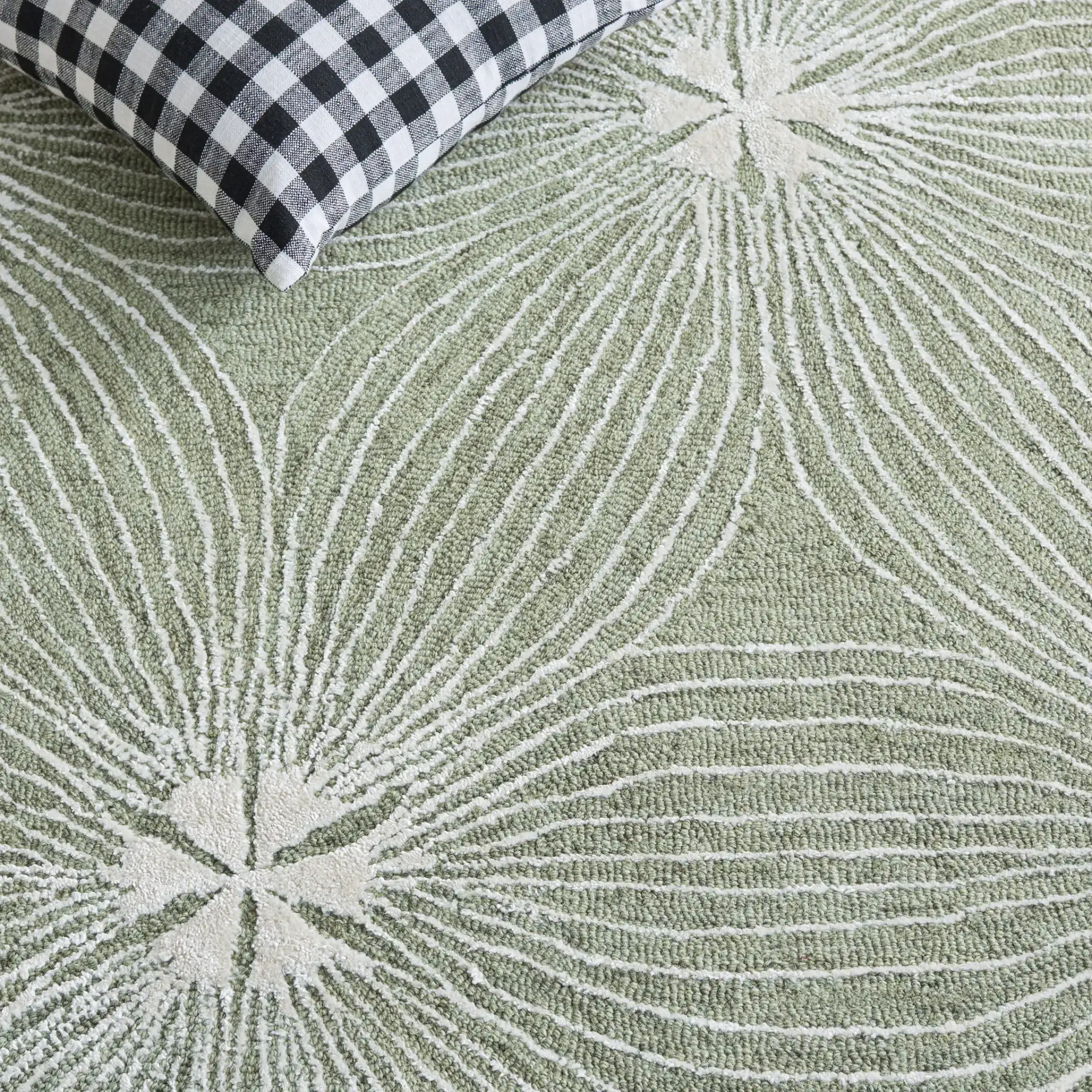 Glamour Floral Burst Hand-Tufted Rug in Sage / Ivory in a styled room