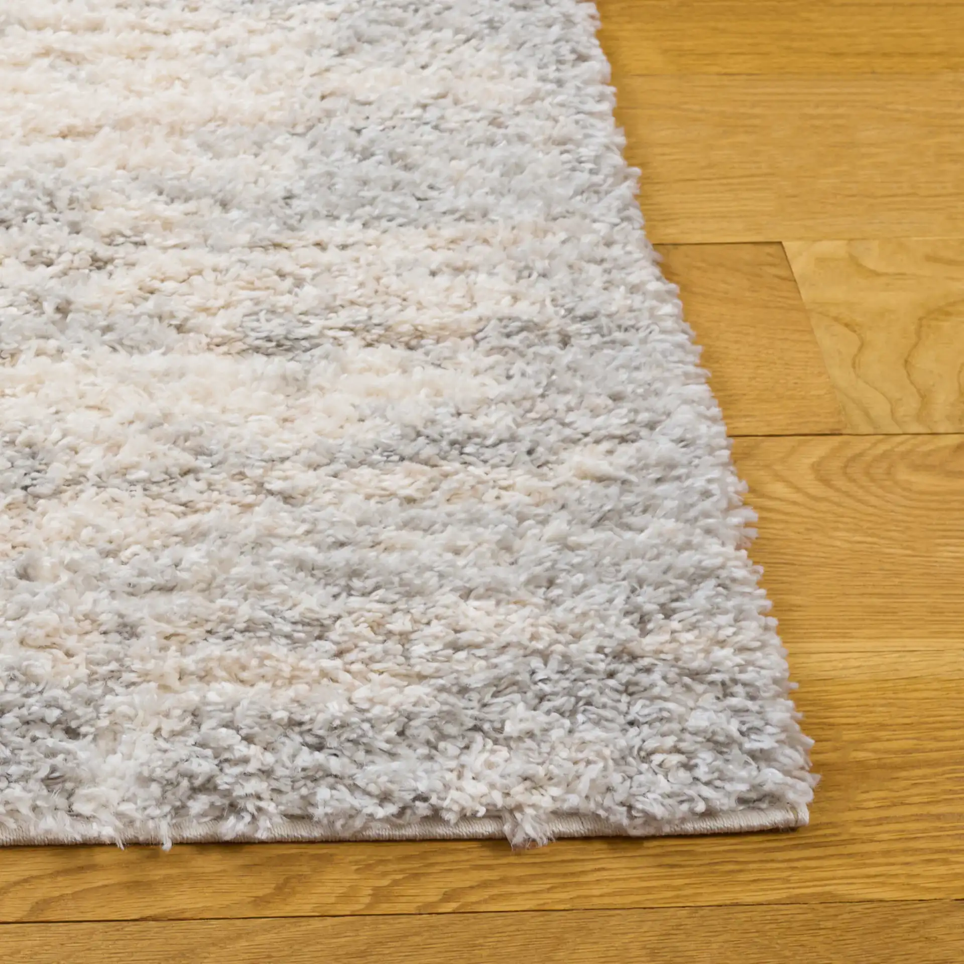 Gemma Milan Abstract Shag Rug in Ivory / Beige Gray in a styled room
