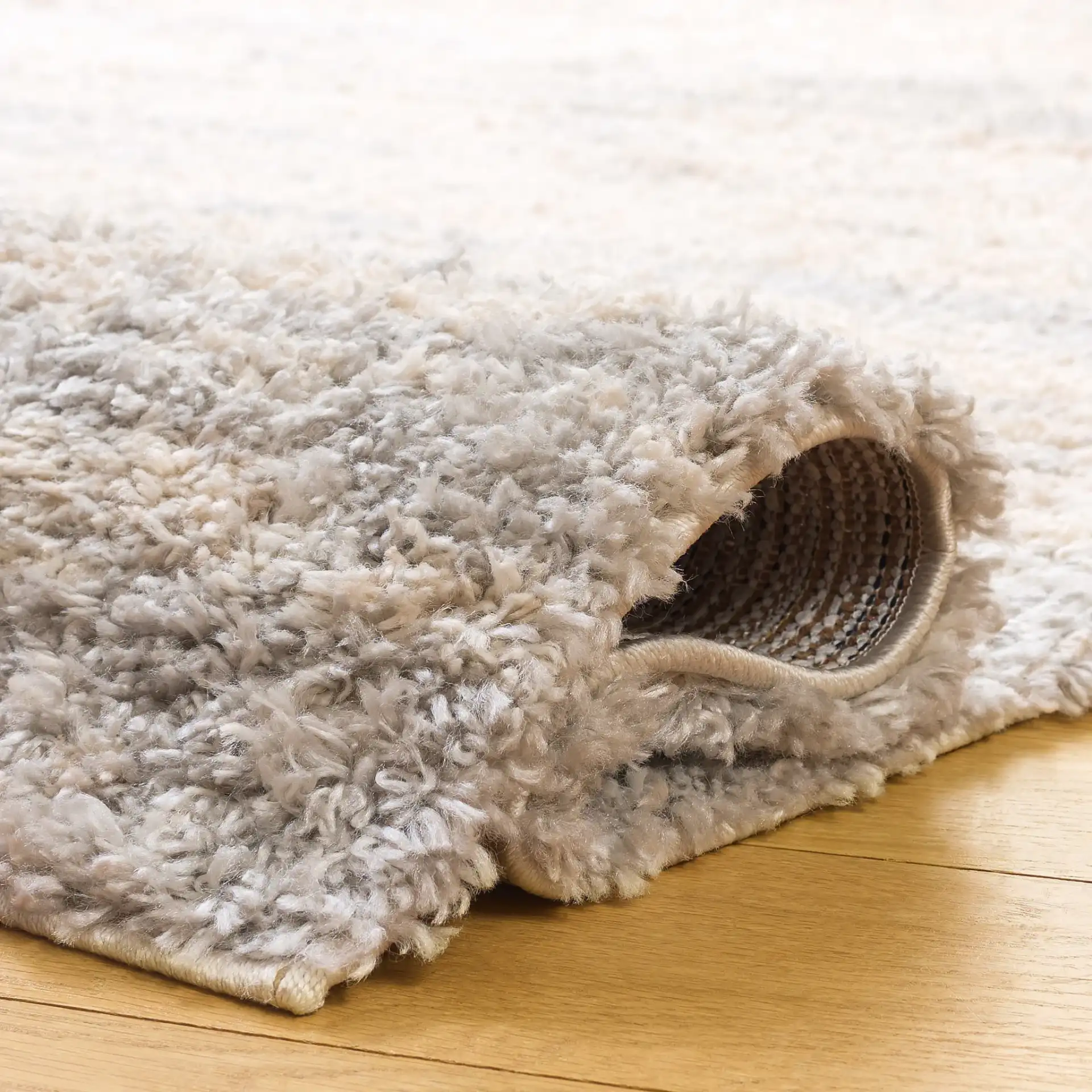 Gemma Milan Abstract Shag Rug in Ivory / Beige Gray in a styled room