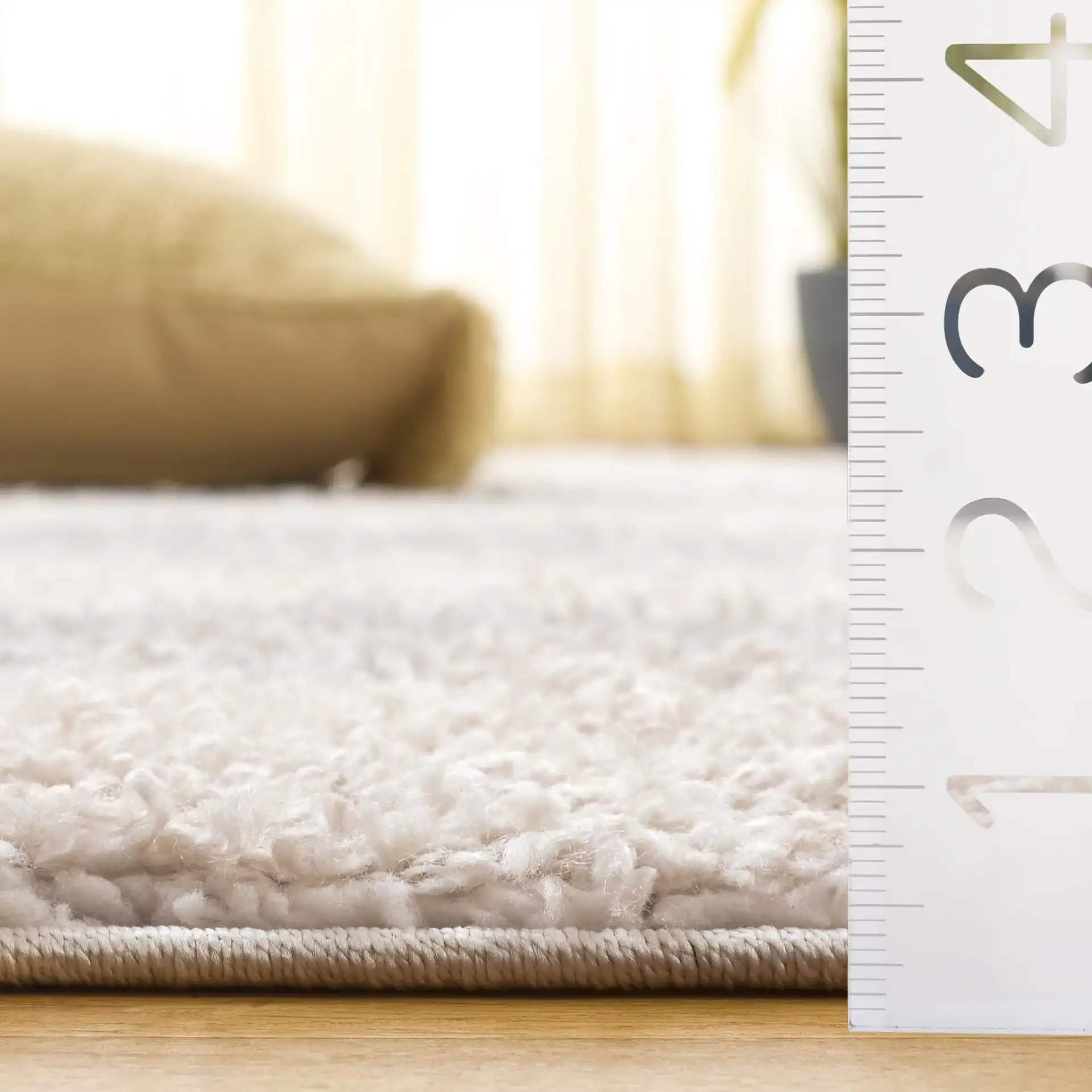 Gemma Tulum Banded Stripe Shag Rug in Ivory / Beige Gray in a styled room