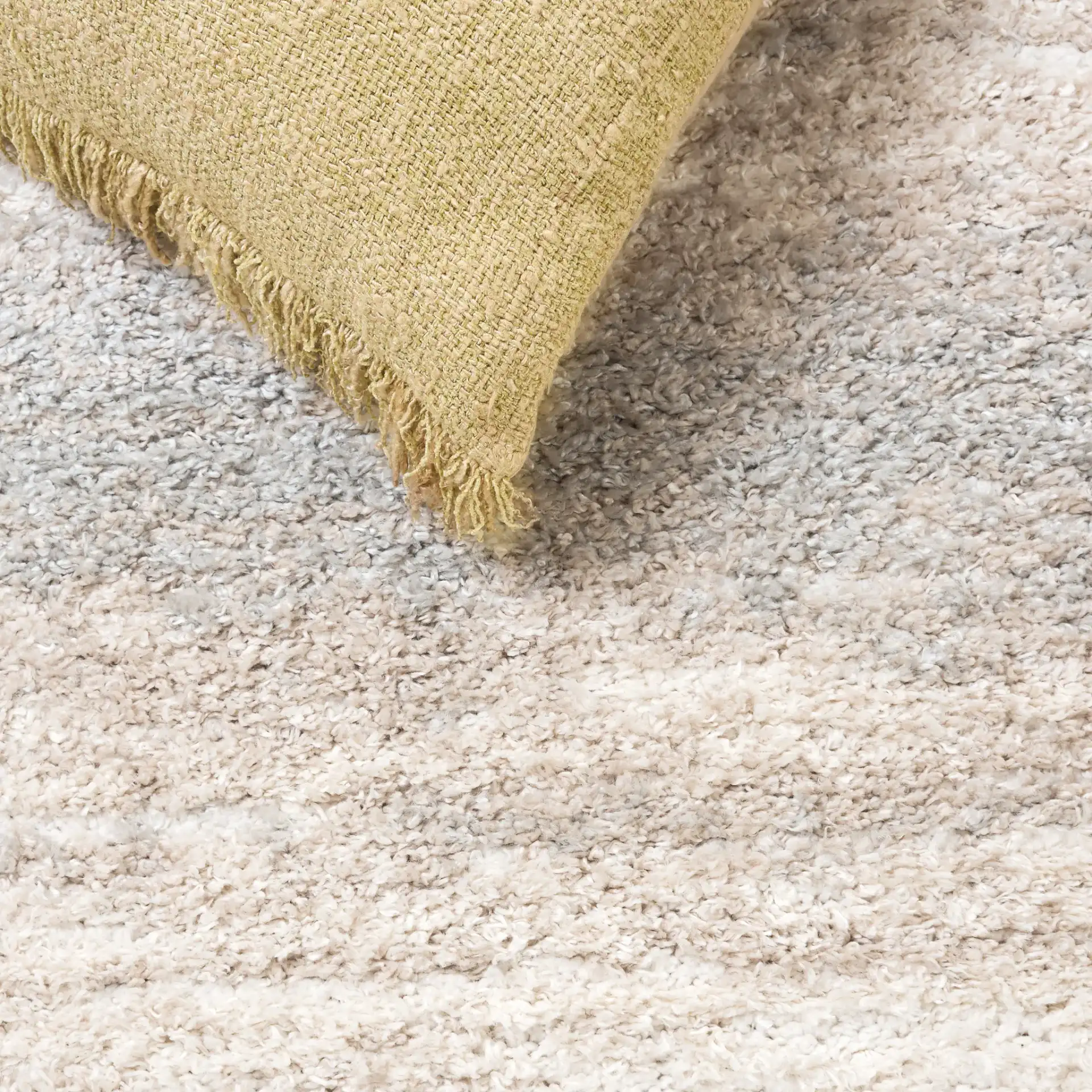 Gemma Tulum Banded Stripe Shag Rug in Ivory / Beige Gray in a styled room