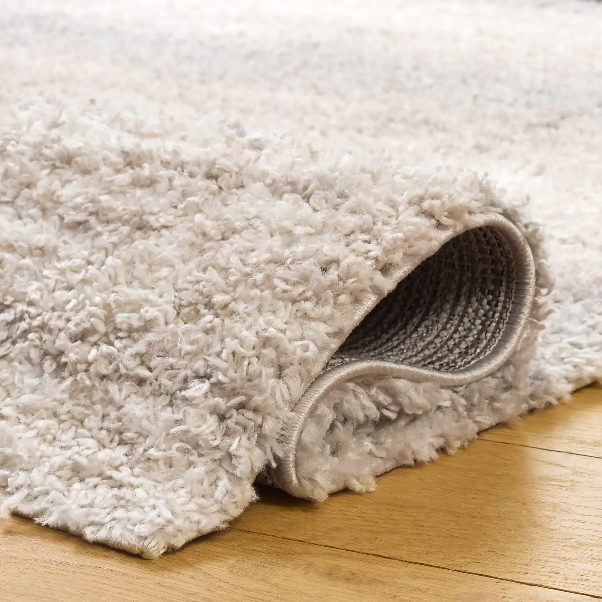 Gemma Tulum Banded Stripe Shag Rug in Ivory / Beige Gray in a styled room
