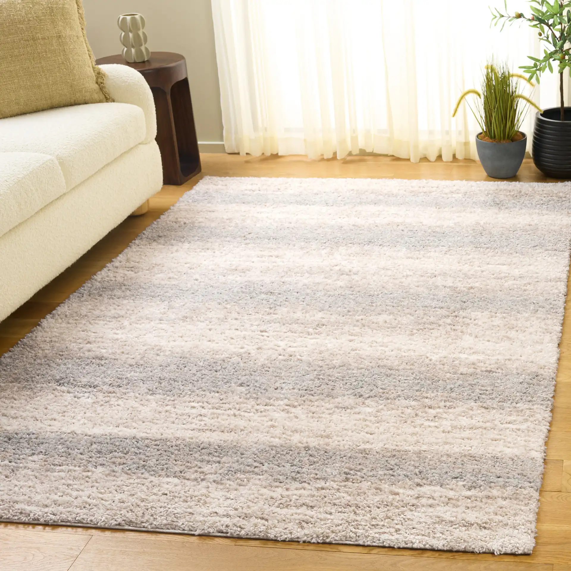 Gemma Tulum Banded Stripe Shag Rug in Ivory / Beige Gray in a styled room