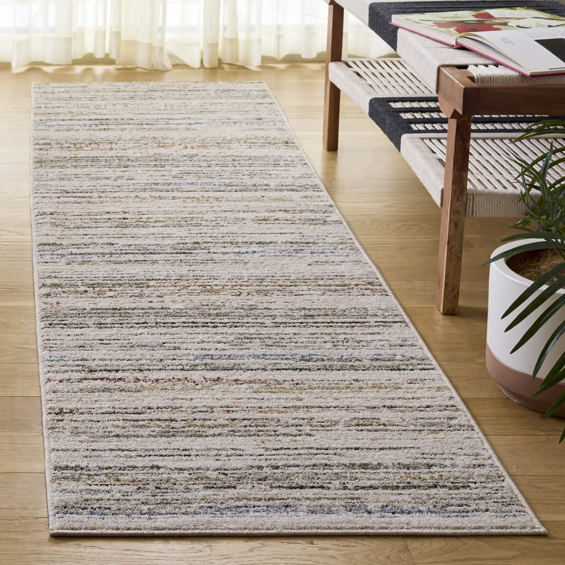 Grove Linear Stripe Rug in Ivory / Blue Rust in a styled room