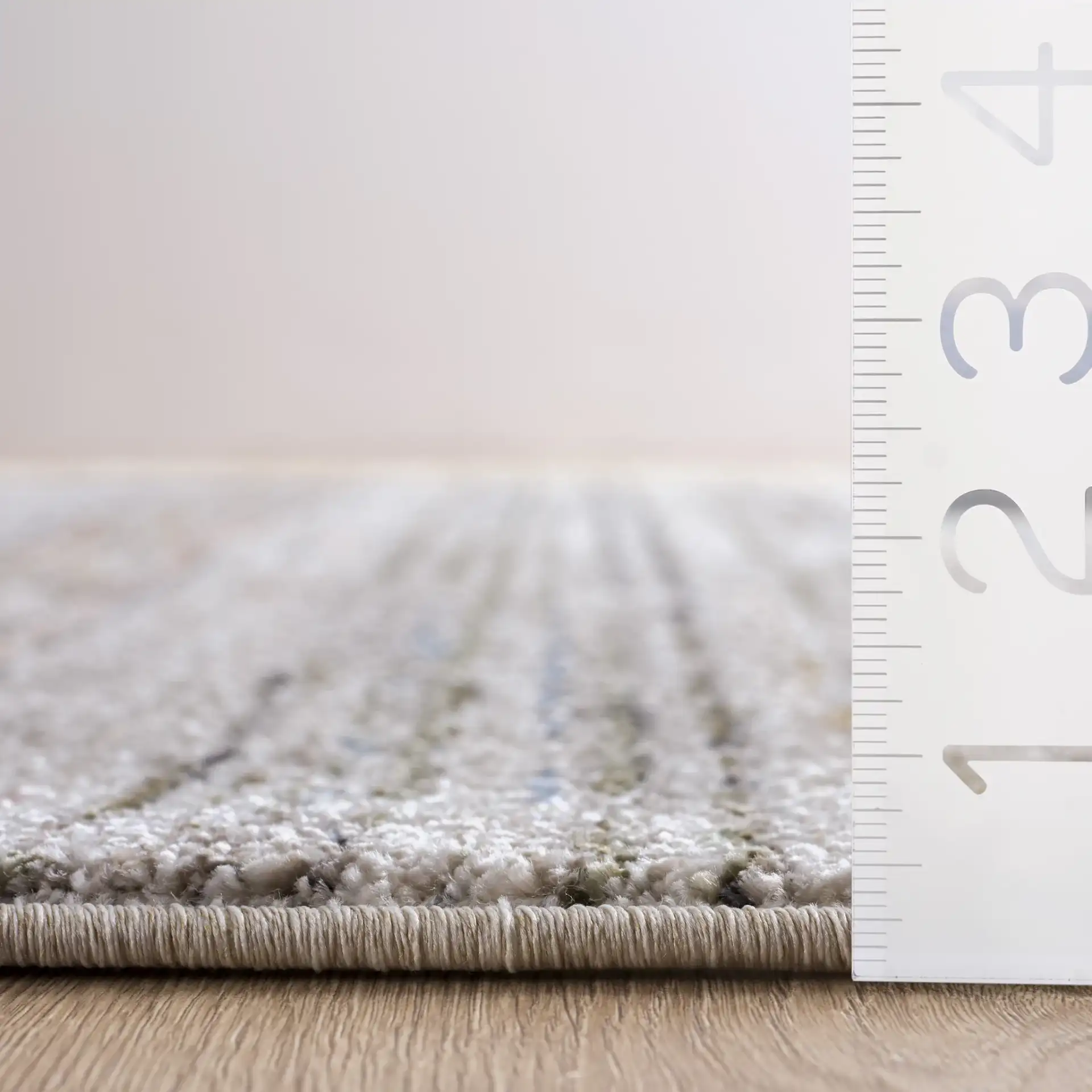 Grove Linear Stripe Rug in Ivory / Blue Rust in a styled room