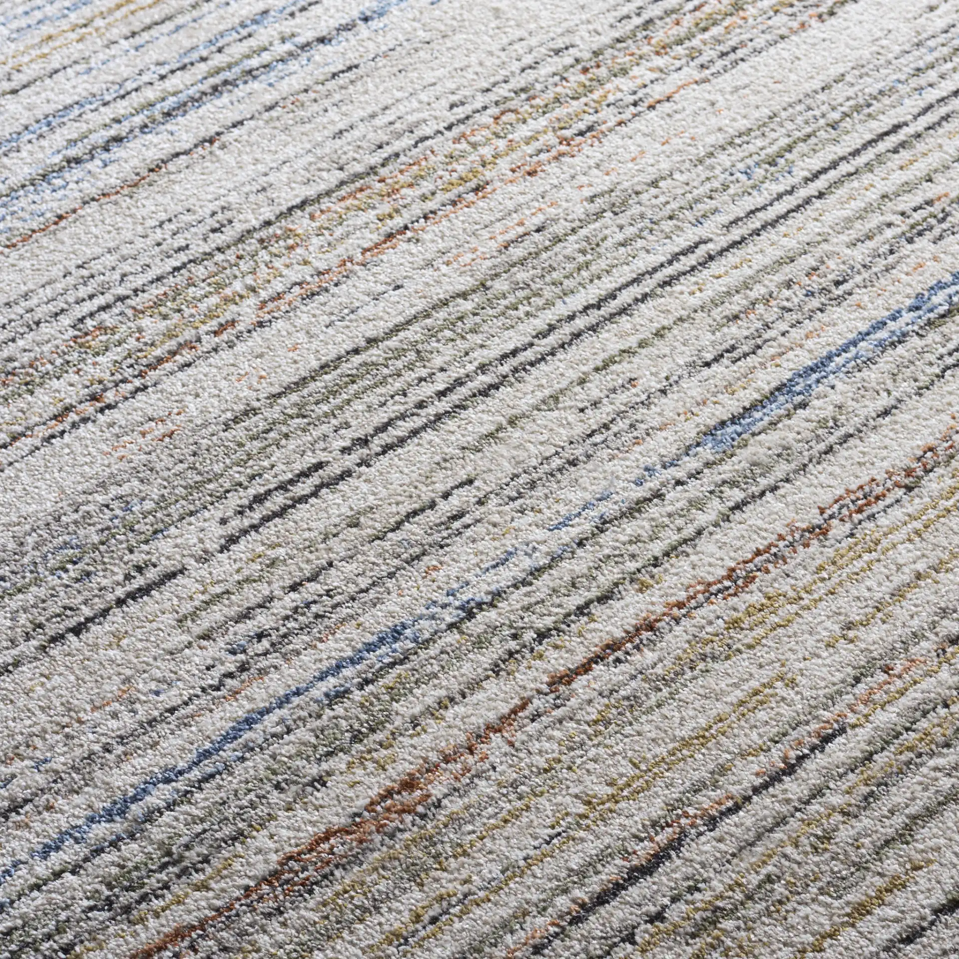 Grove Linear Stripe Rug in Ivory / Blue Rust in a styled room