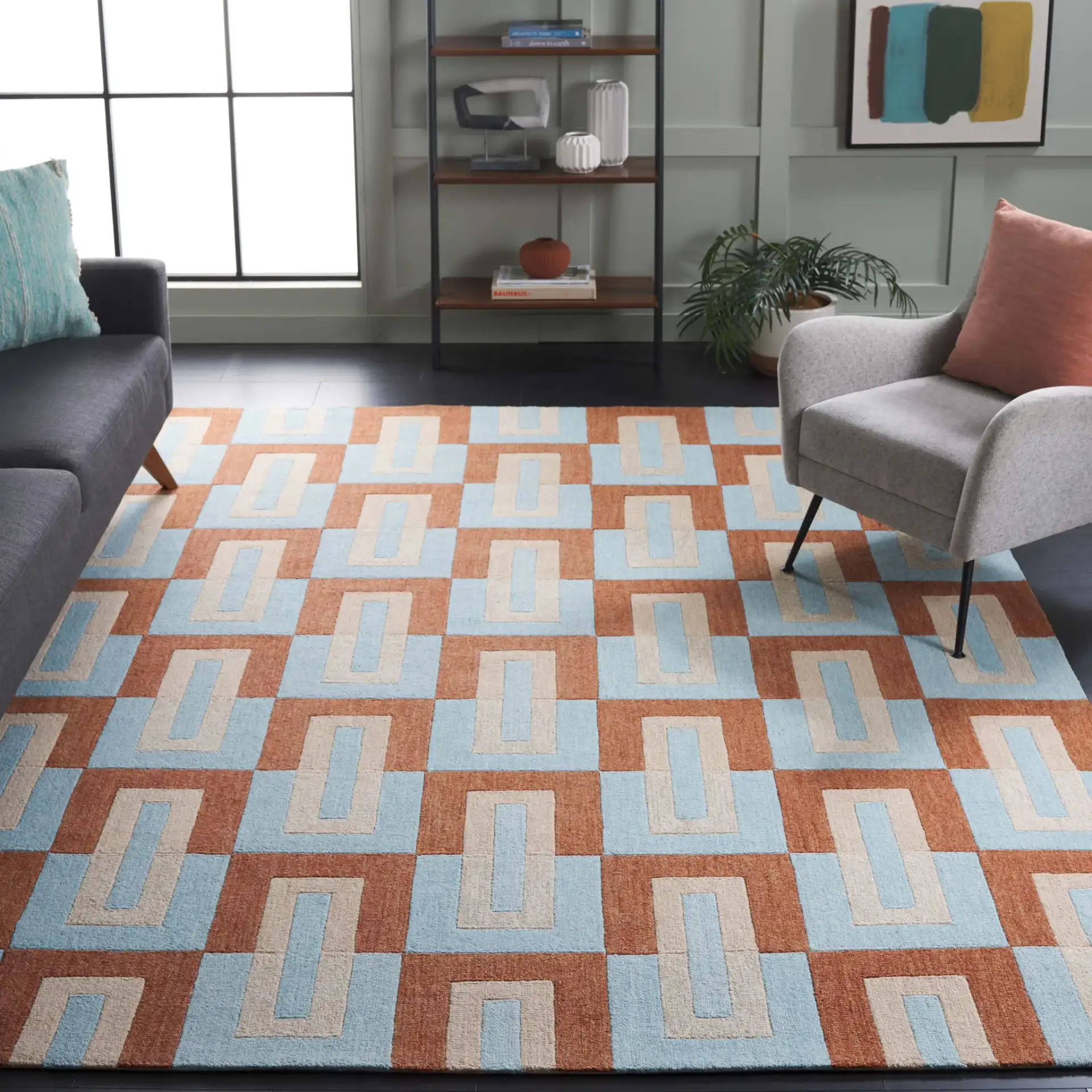 Genre Interlocking Rectangles Hand-Tufted Wool Rug in Light Blue / Rust in a styled room