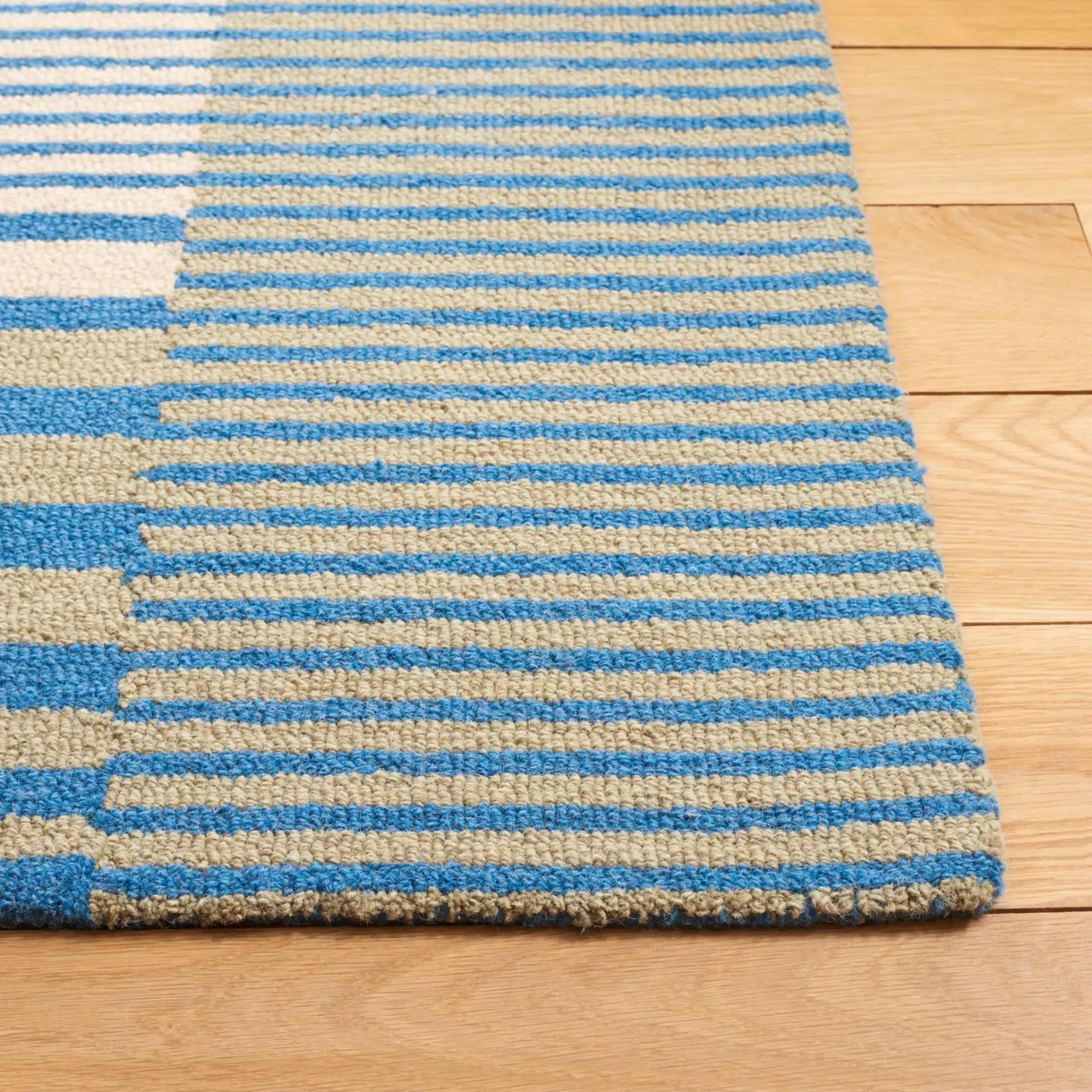 Genre Blocked Stripe Hand-Tufted Wool Rug in Blue / Ivory in a styled room