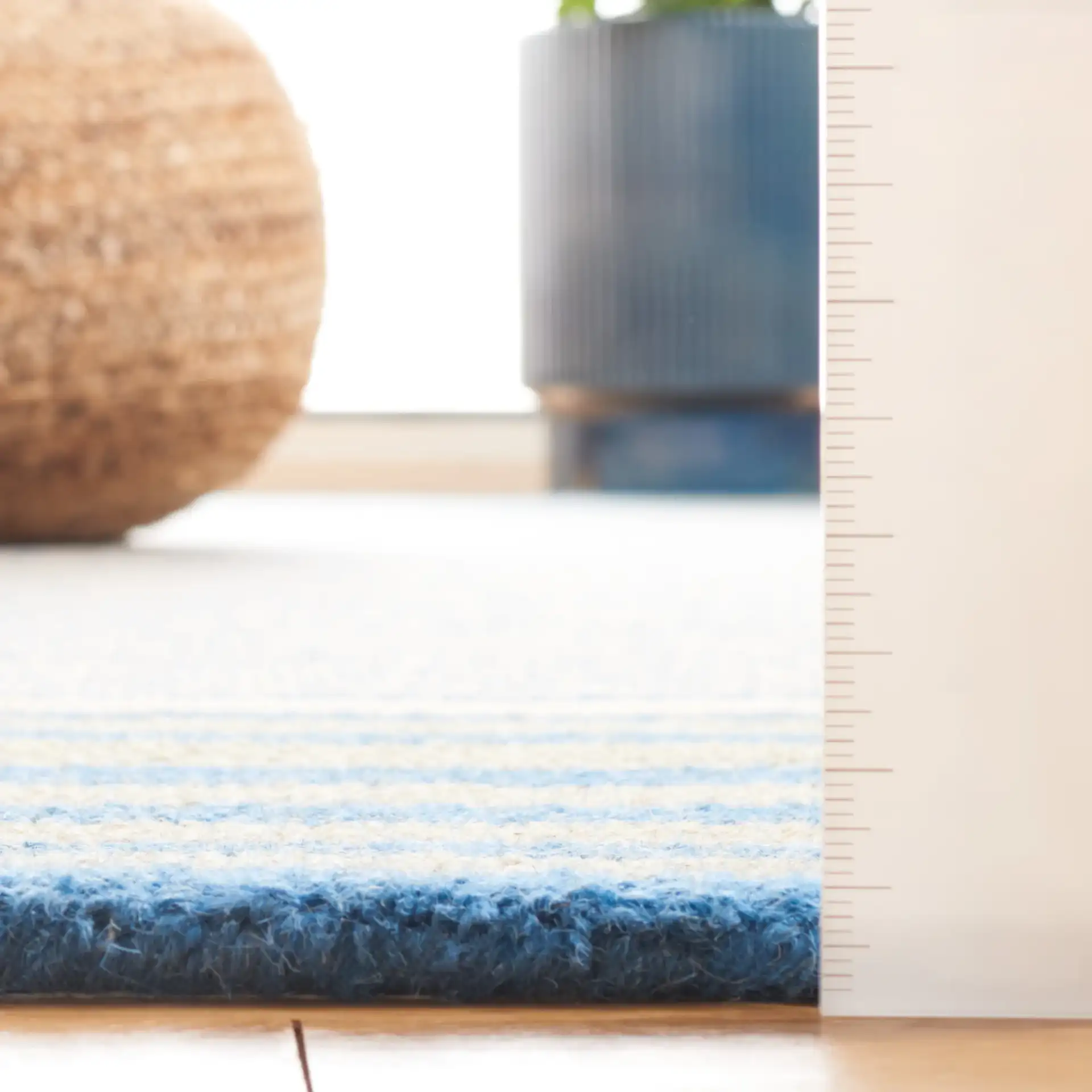 Genre Blocked Stripe Hand-Tufted Wool Rug in Blue / Ivory in a styled room