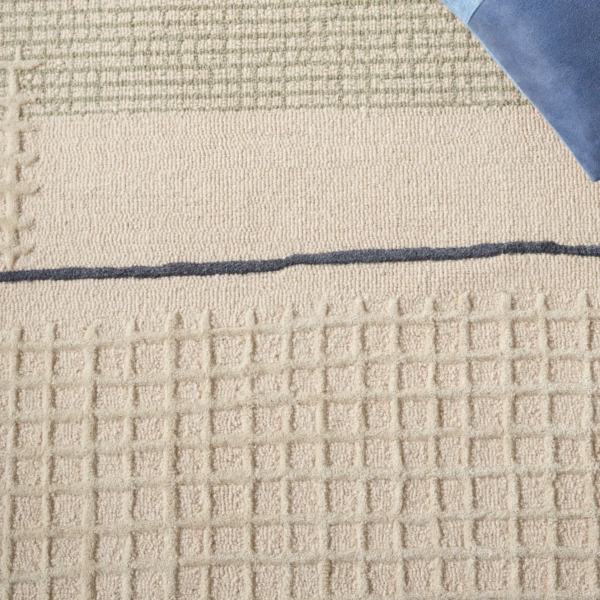 Genre Textured Grid Hand-Tufted Wool Rug in Beige / Gray in a styled room