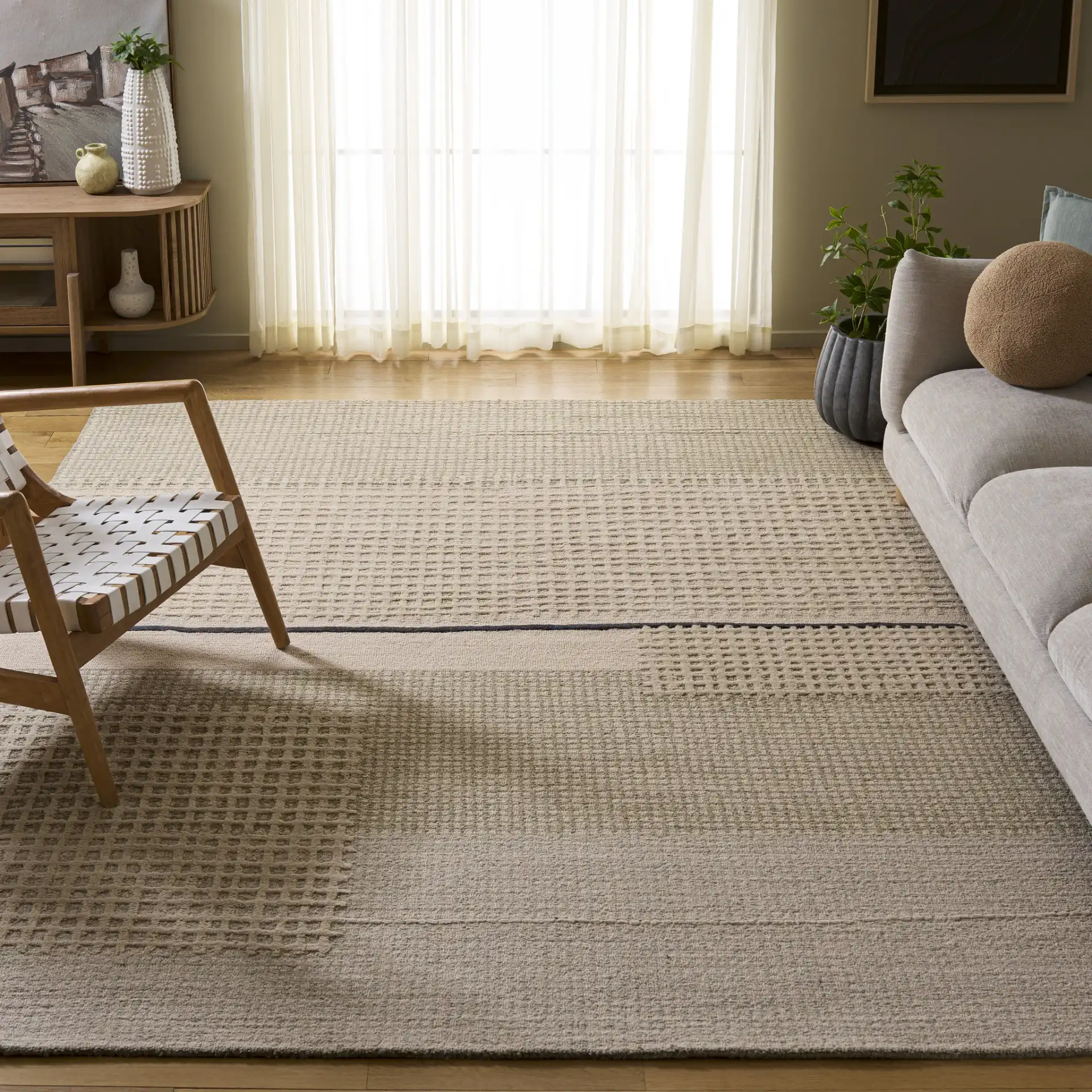 Genre Textured Grid Hand-Tufted Wool Rug in Beige / Gray in a styled room