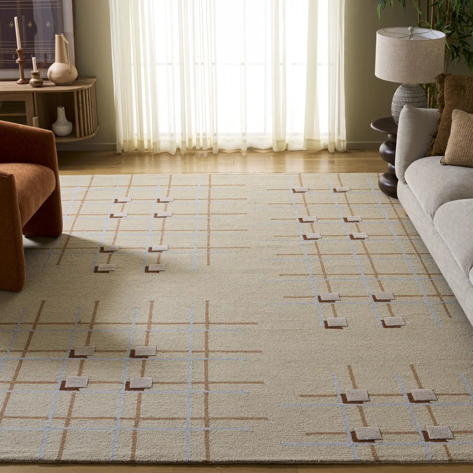 Genre Asymmetric Grid Hand-Tufted Wool Rug in Beige / Rust in a styled room