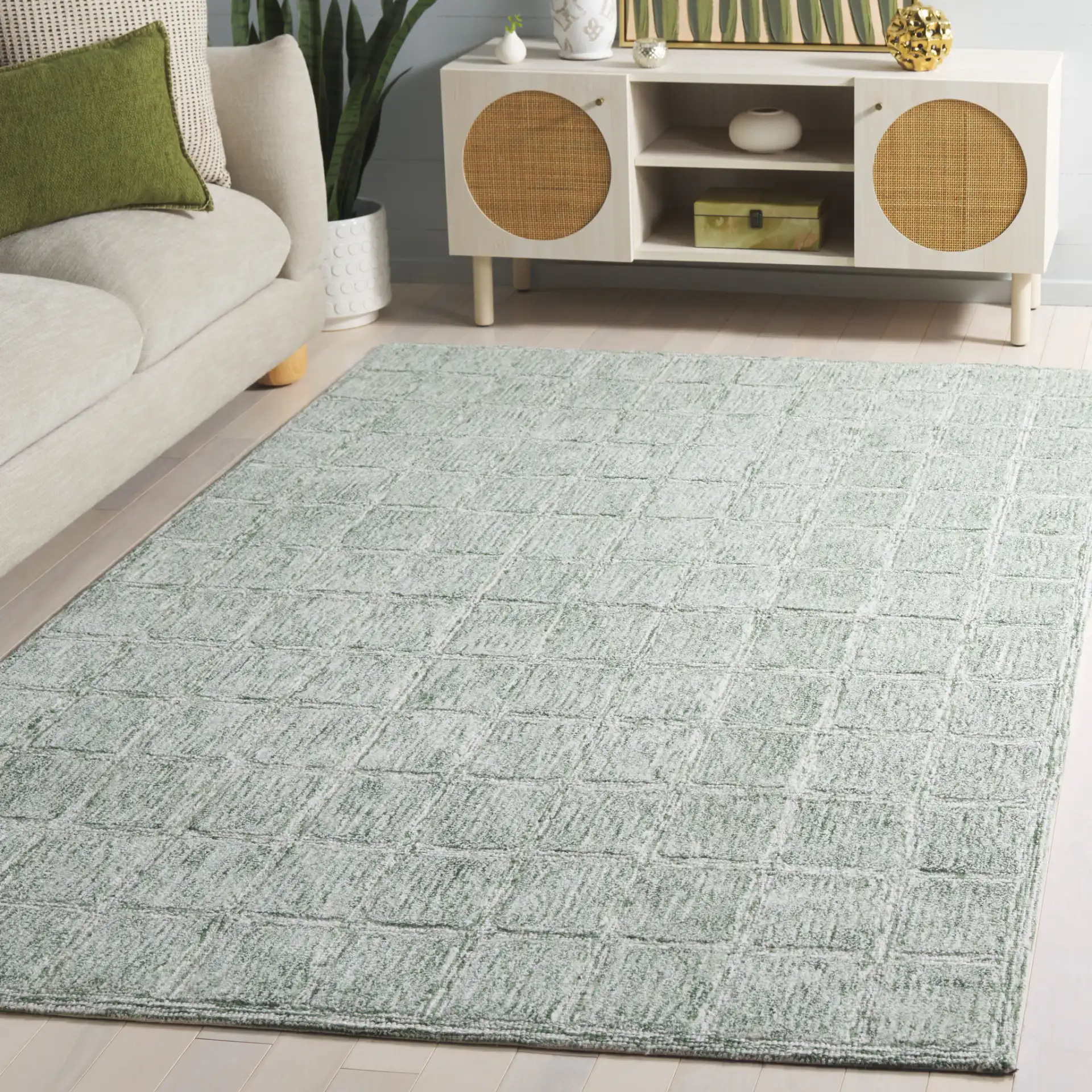 Genre Grid Hand-Woven Wool Rug in Green / Ivory in a styled room