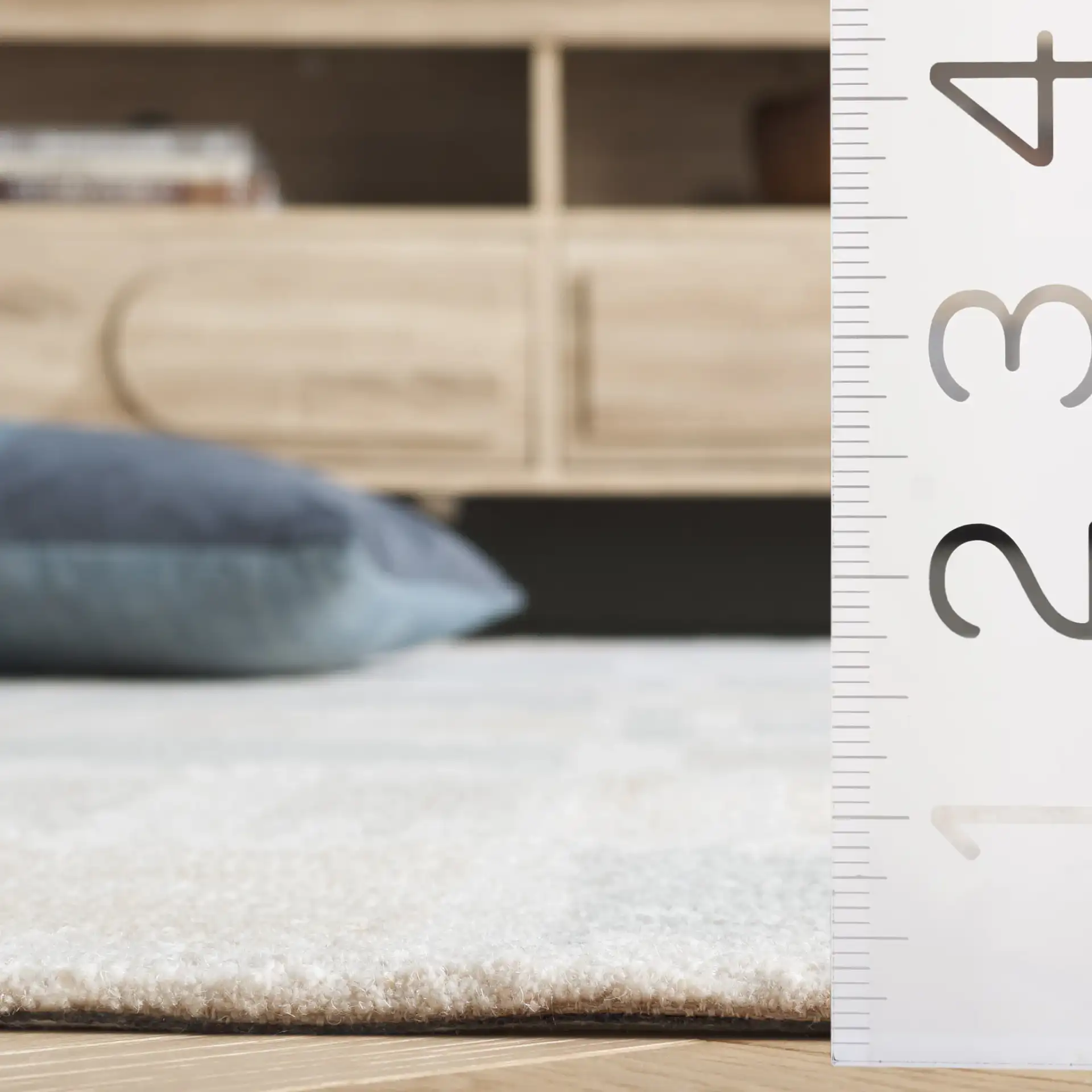 Genre Checkered Block Hand-Tufted Wool Rug in Beige / Gray in a styled room