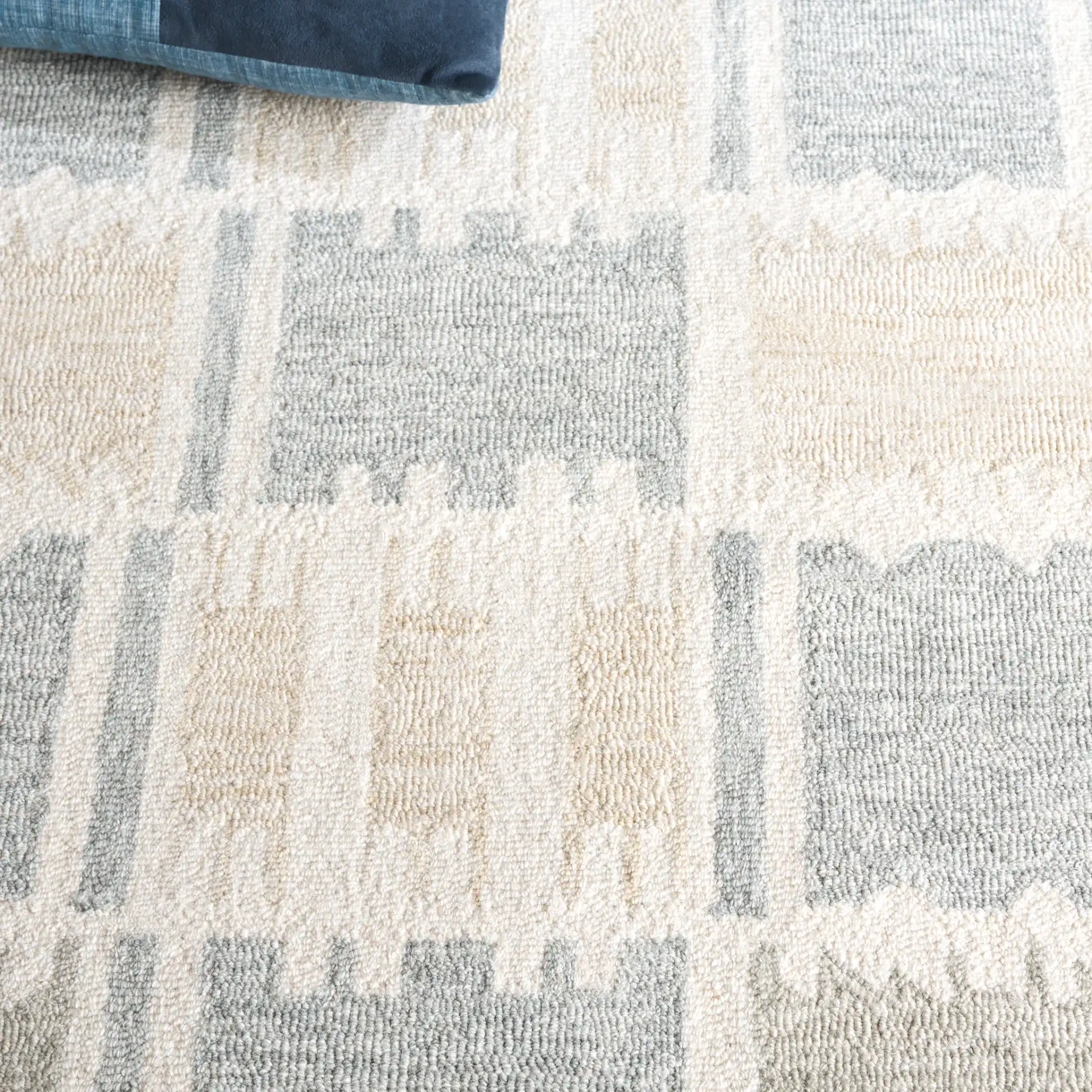 Genre Checkered Block Hand-Tufted Wool Rug in Beige / Gray in a styled room