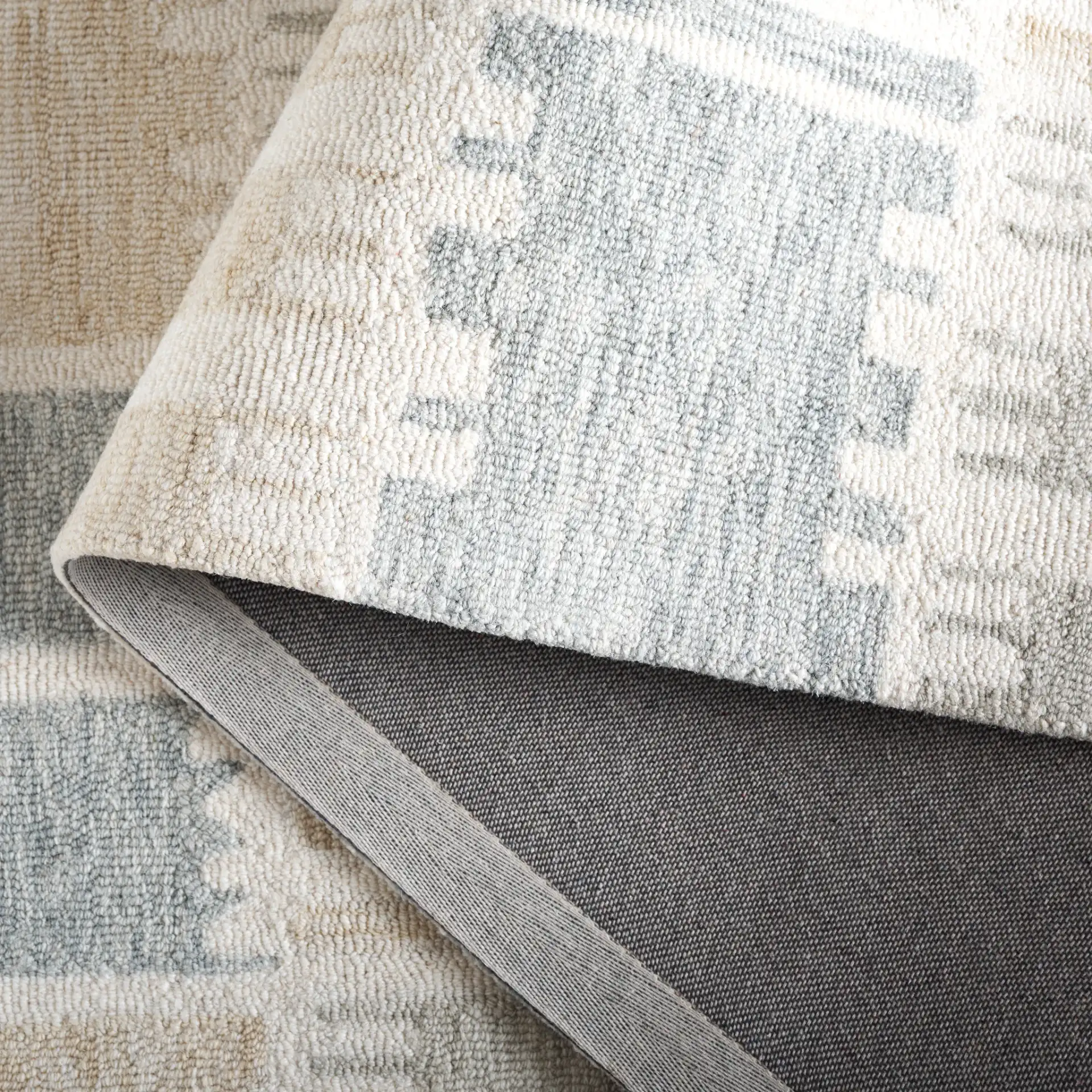 Genre Checkered Block Hand-Tufted Wool Rug in Beige / Gray in a styled room
