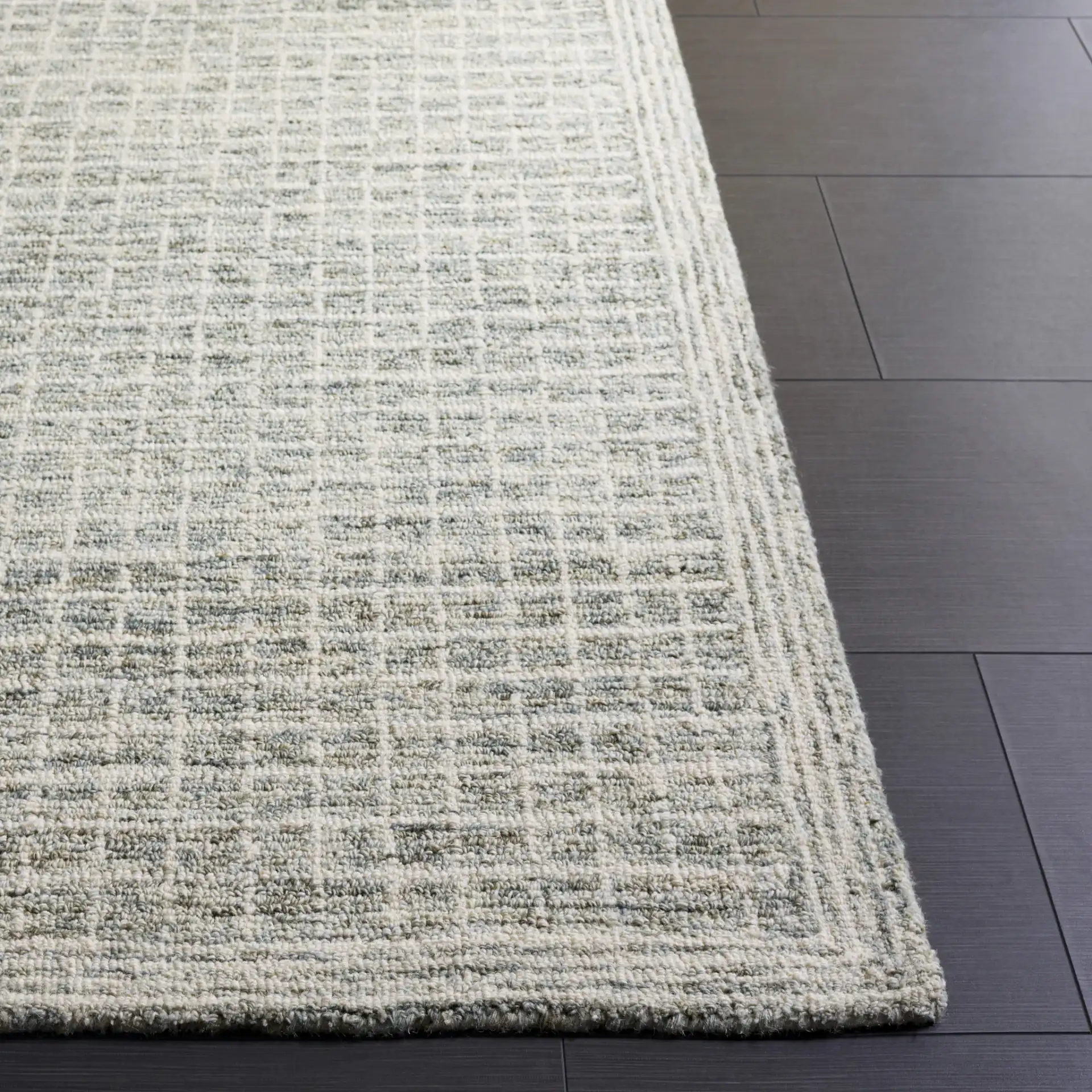 Genre Modern Grid Hand-Tufted Wool Rug in Sage / Ivory in a styled room