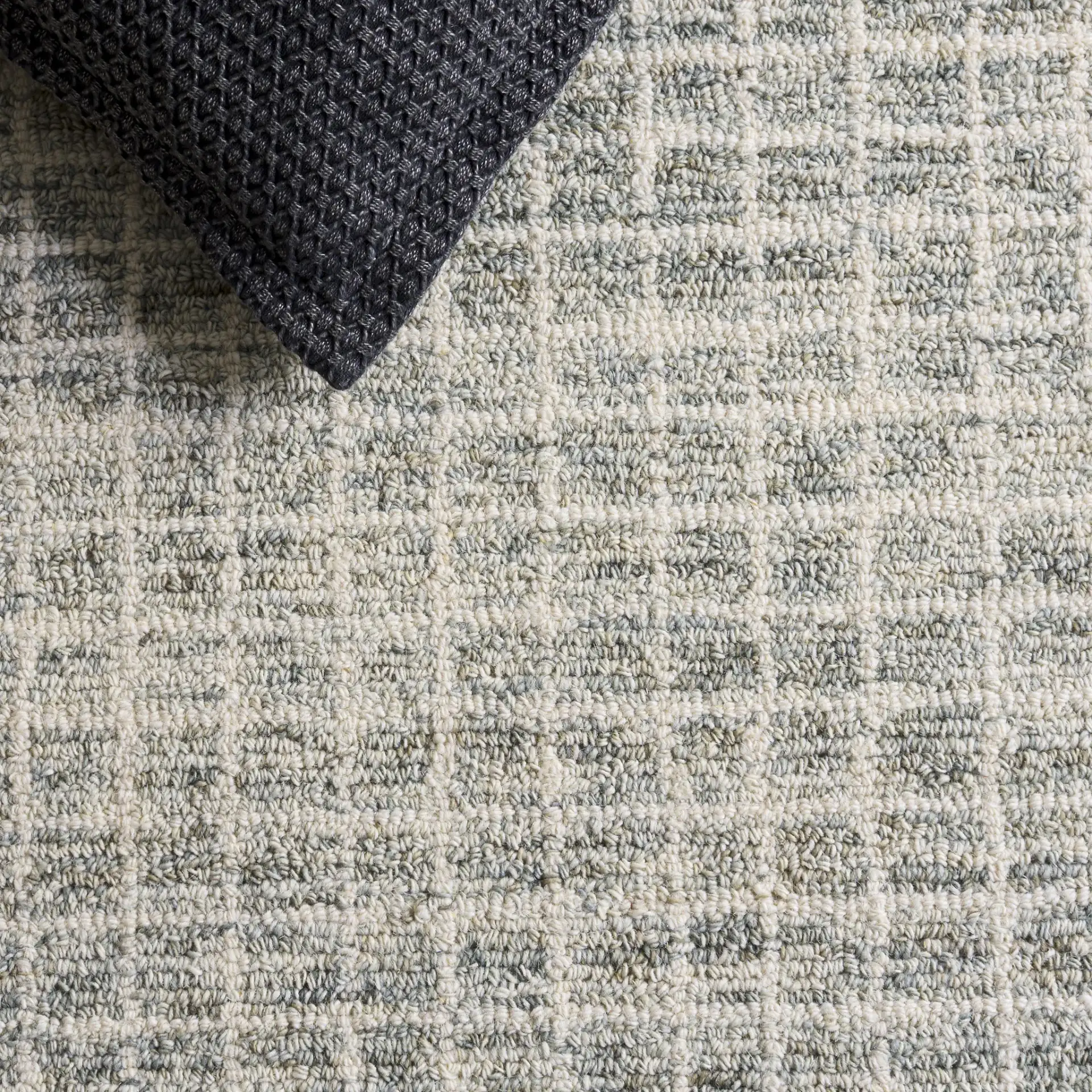 Genre Modern Grid Hand-Tufted Wool Rug in Sage / Ivory in a styled room