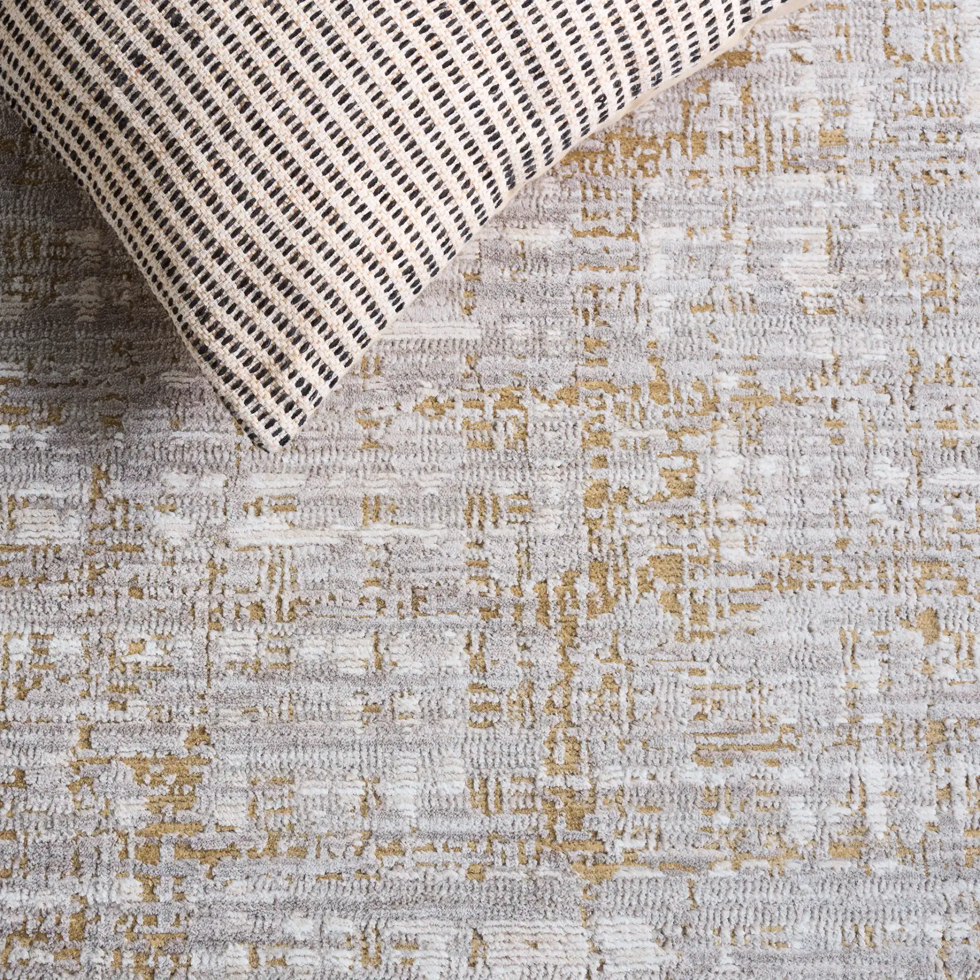 Garnet Distressed Grid Rug in Gold / Gray in a styled room