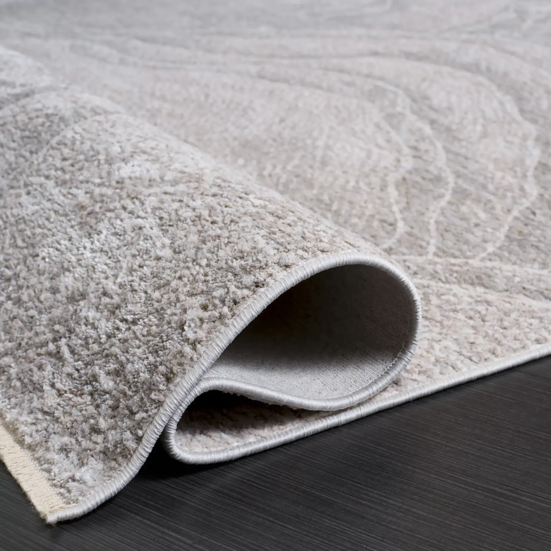 Garnet Abstract Wave Rug in Ivory / Gray in a styled room