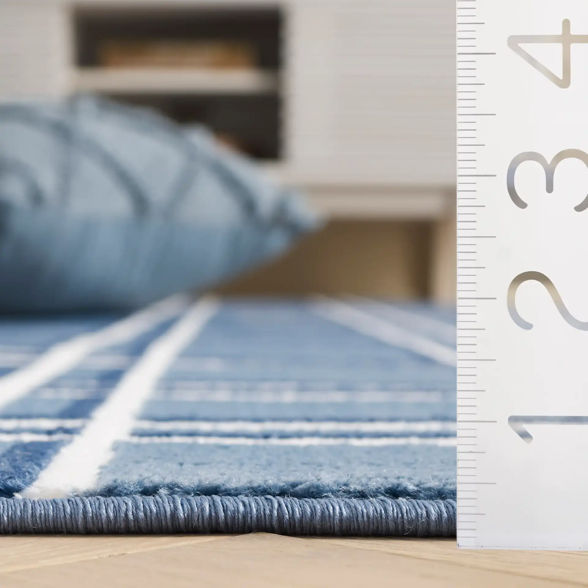 Groove Grid Rug in Blue / Ivory in a styled room