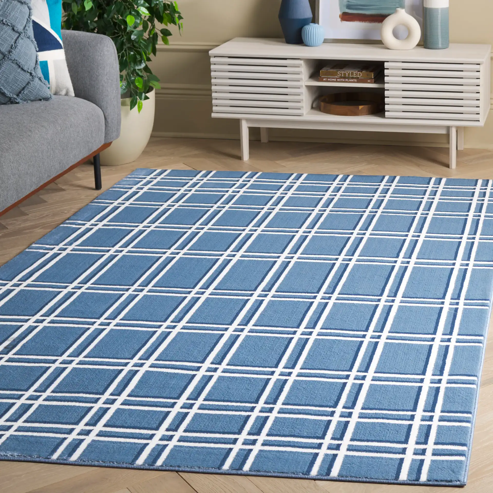 Groove Grid Rug in Blue / Ivory in a styled room