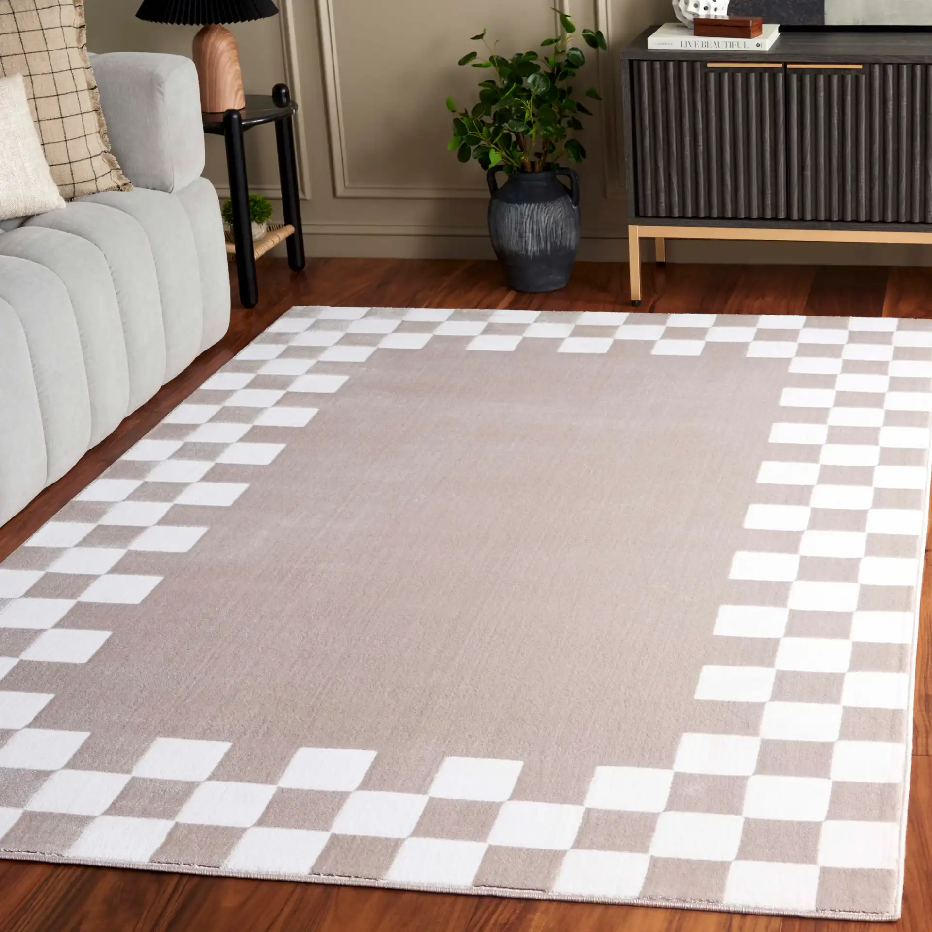 Groove Checkerboard Border Rug in Beige / Ivory in a styled room