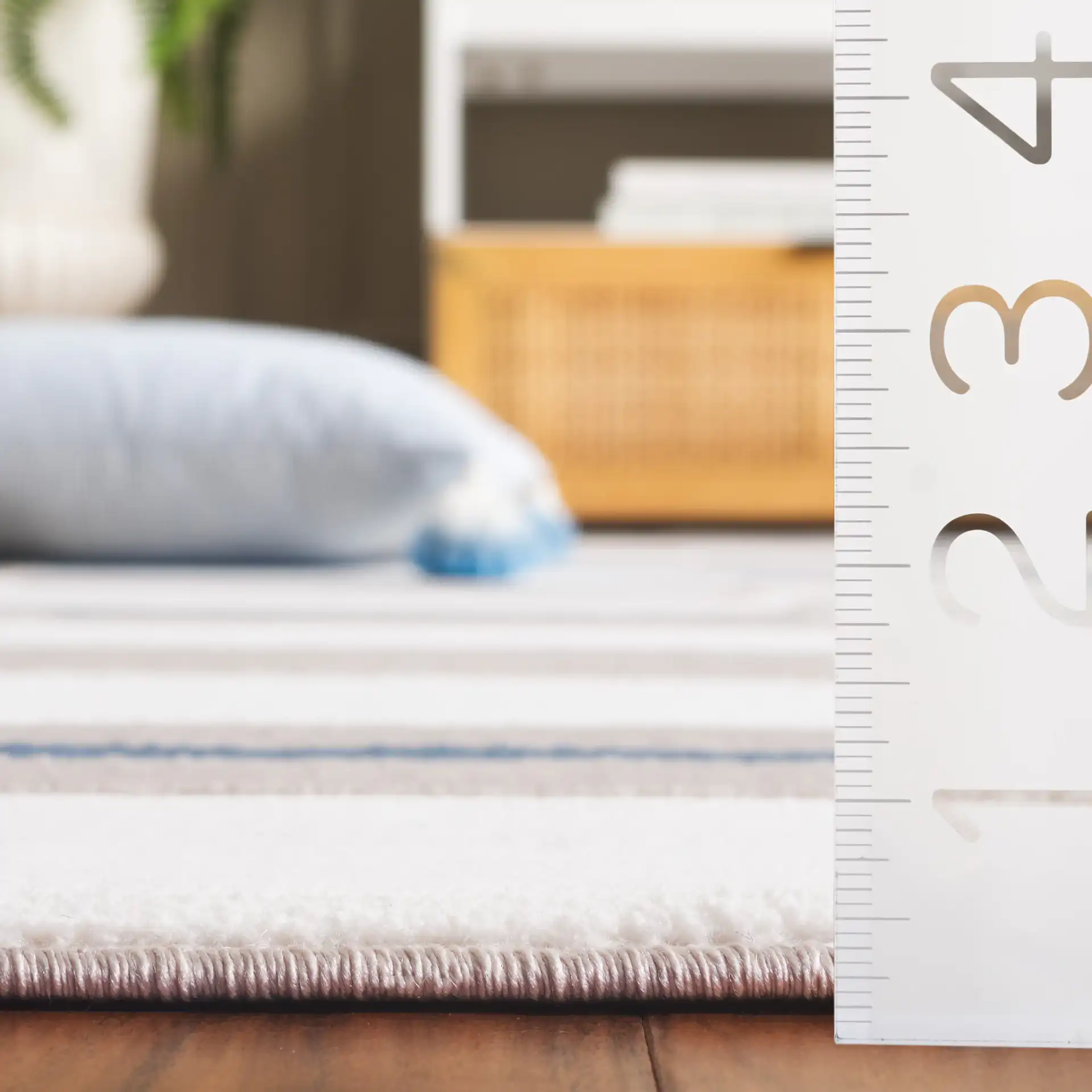 Groove Modern Plaid Rug in Ivory / Blue in a styled room