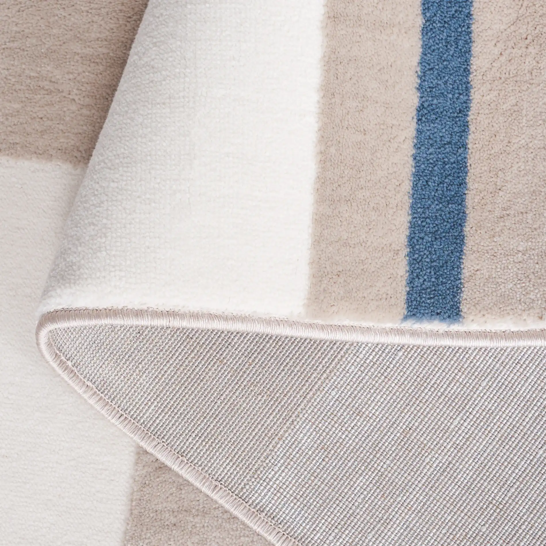 Groove Modern Plaid Rug in Ivory / Blue in a styled room