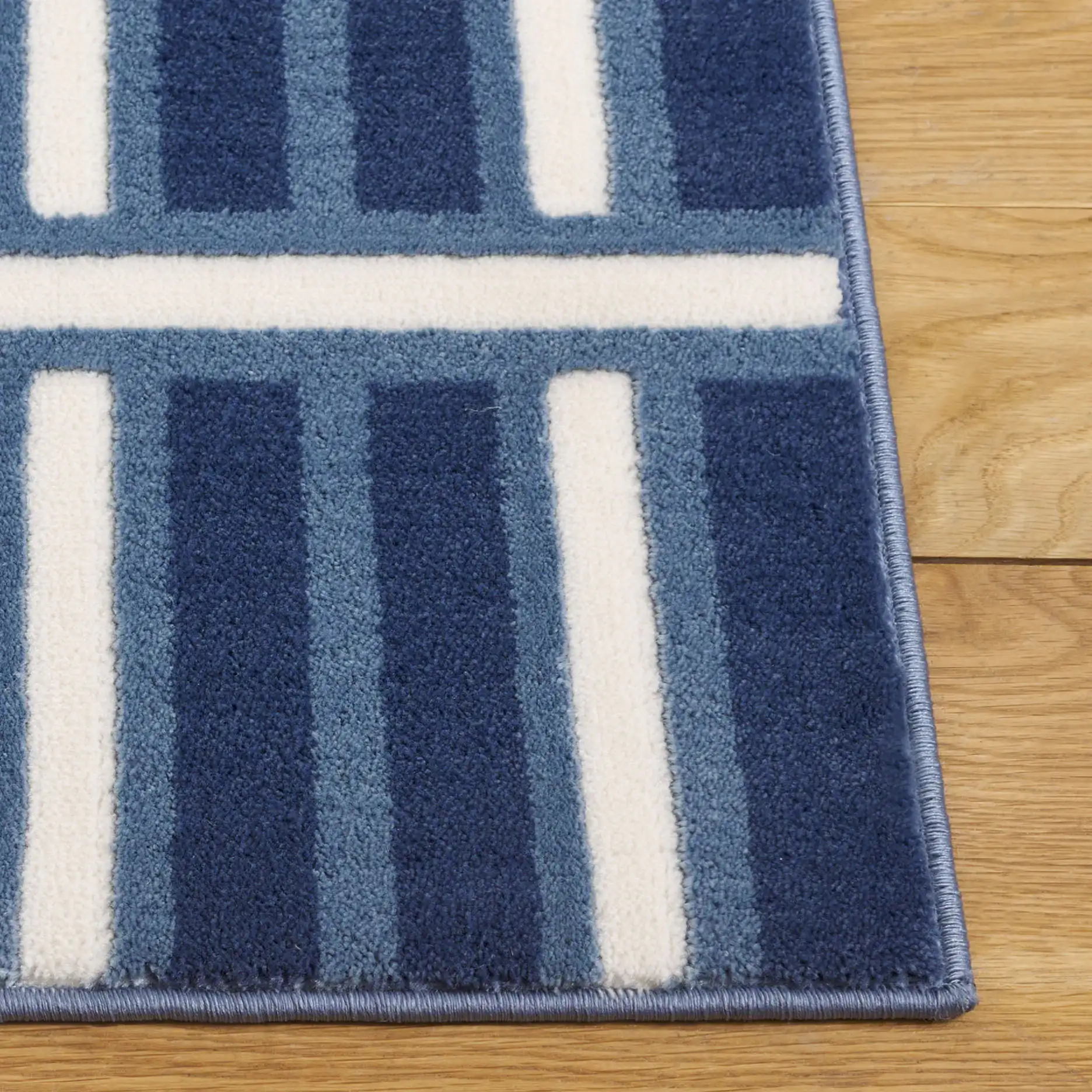 Groove Basketweave Grid Rug in Blue / Ivory in a styled room