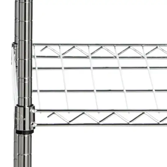 Betsy Adjustable Garment Rack in Chrome in a styled room