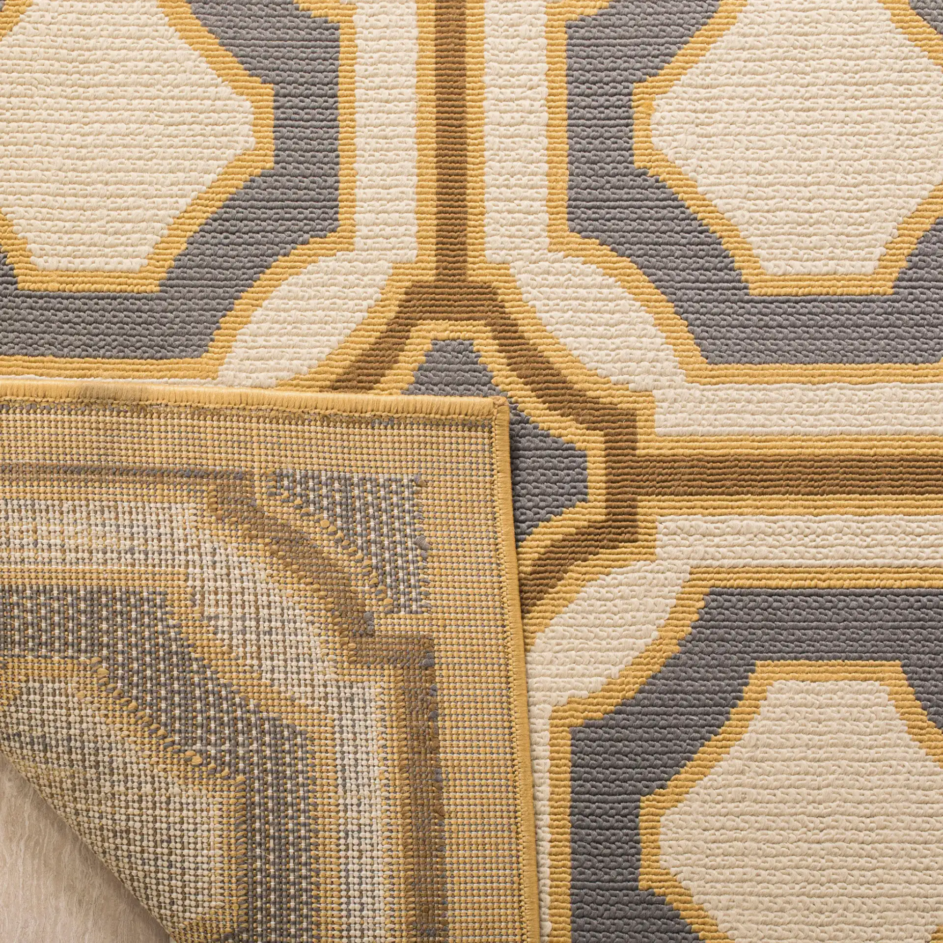 Hampton Geometric Trellis Rug in Dark Gray / Ivory in a styled room