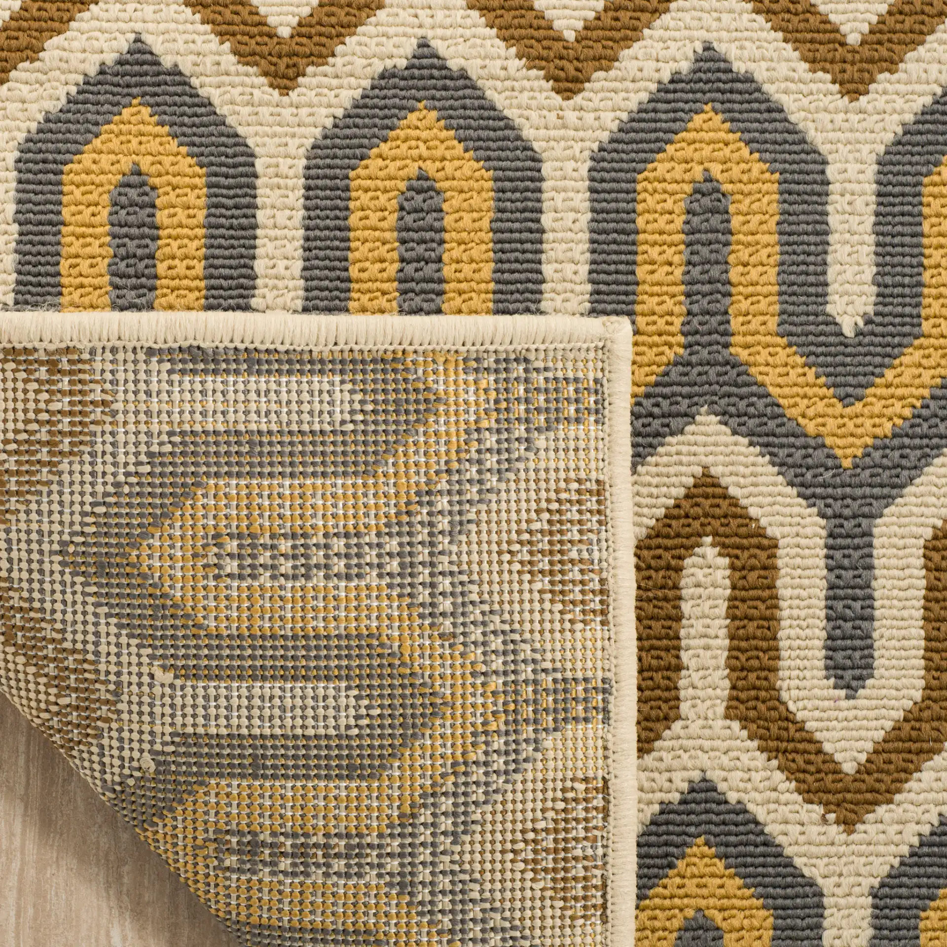 Hampton Stepped Chevron Rug in Brown / Camel in a styled room