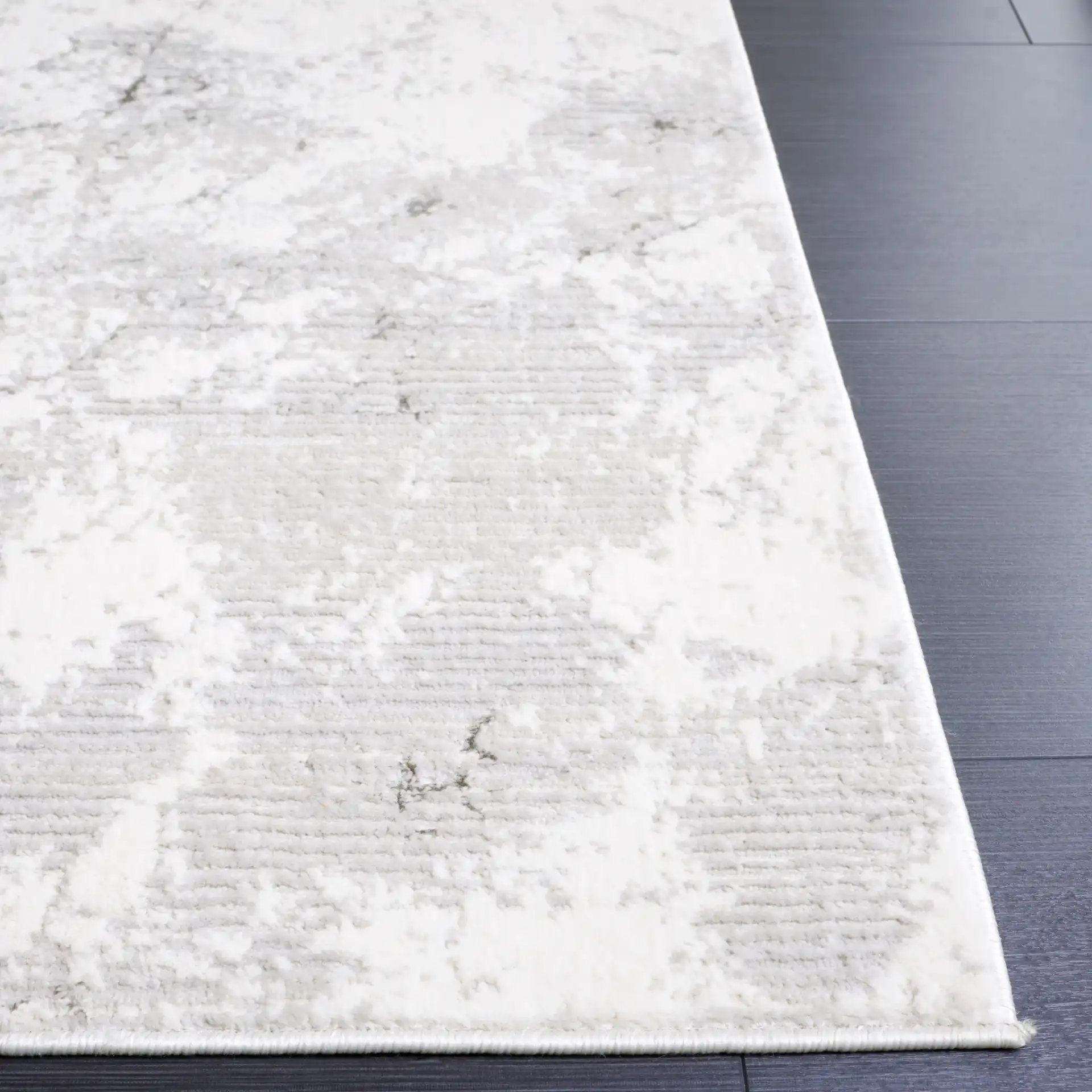 Hanna Marbled Abstract Rug in Gray / Ivory in a styled room