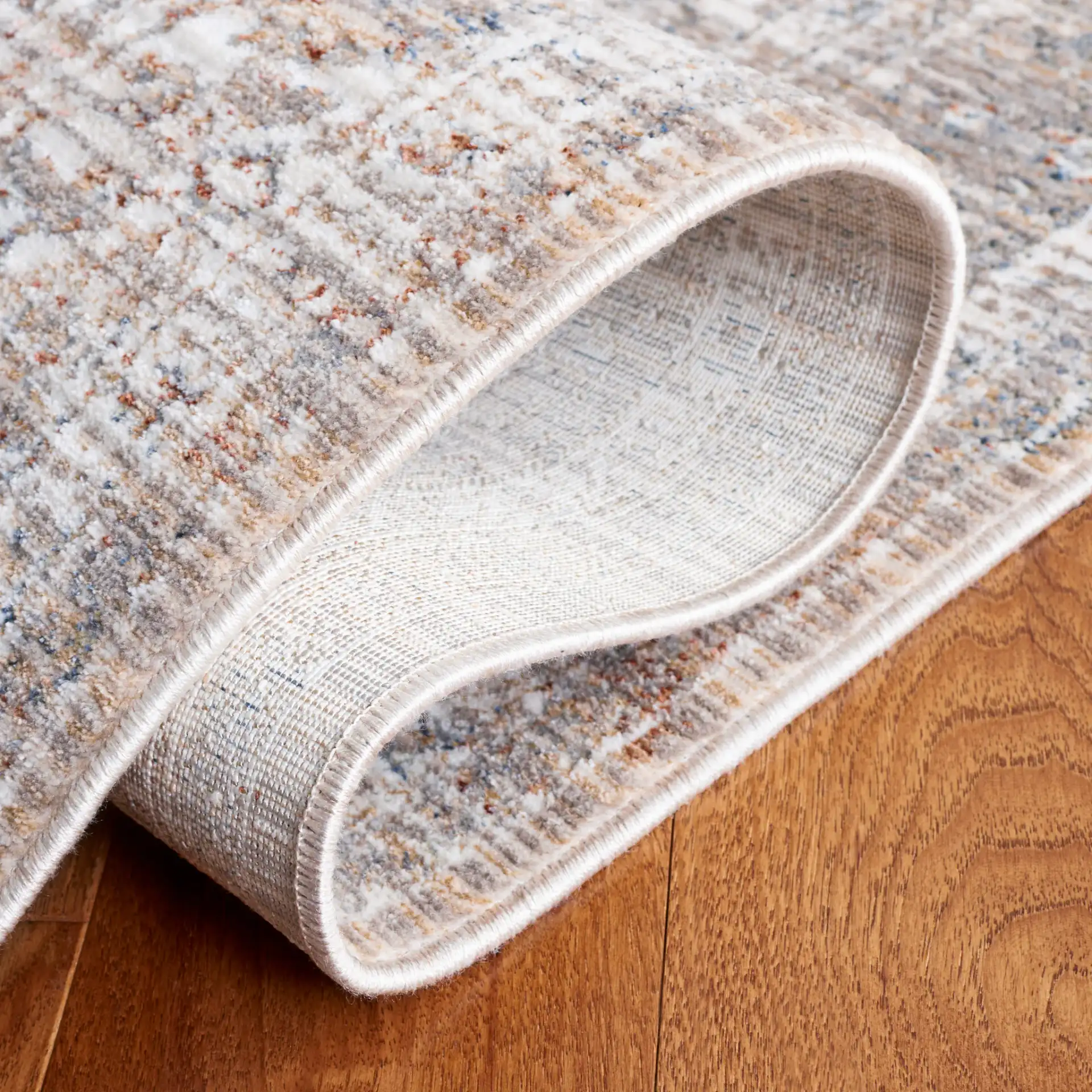Harlow Bordered Floral Rug in Gray / Ivory Blue in a styled room