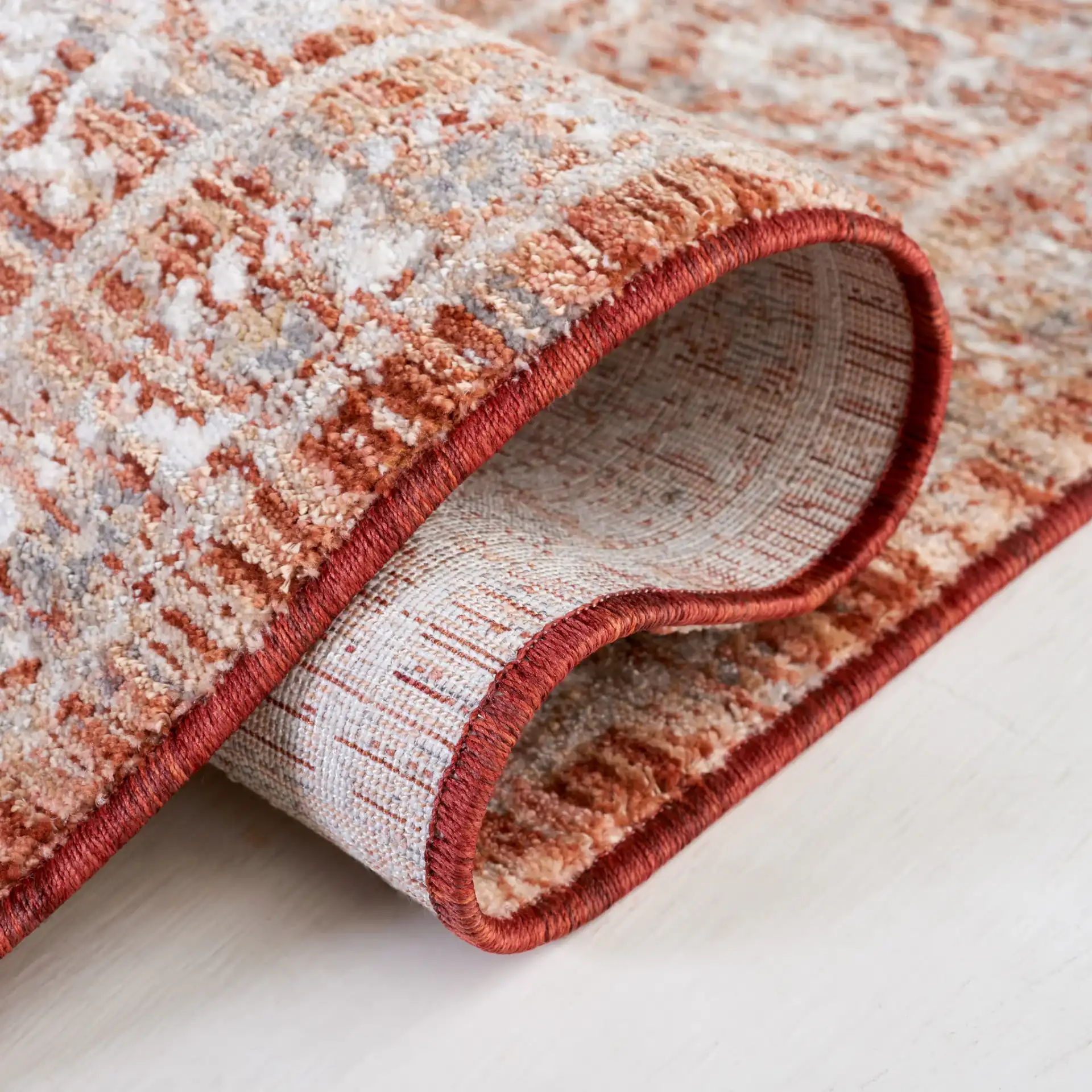 Harlow Floral Medallion Rug in Rust / Ivory Gray in a styled room