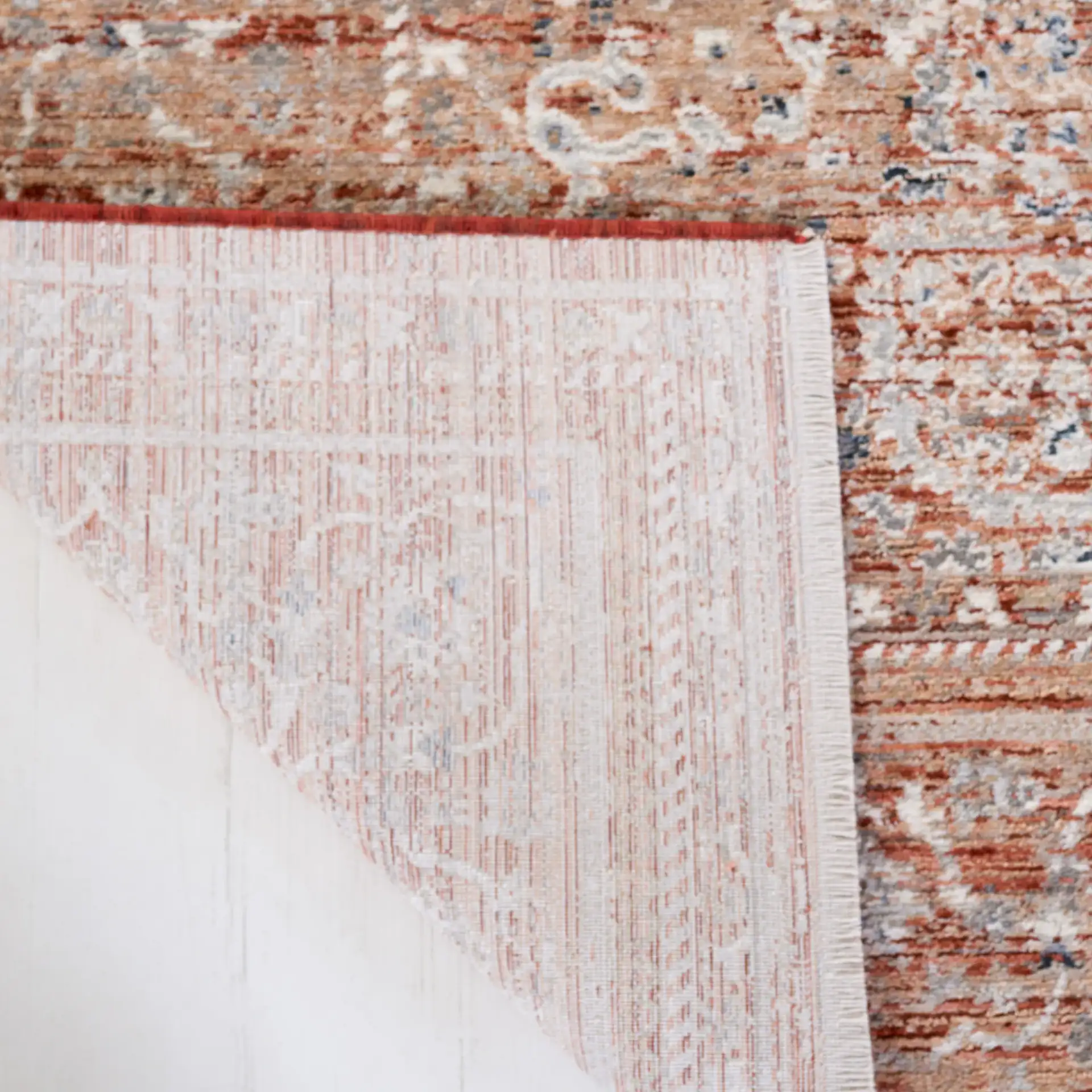 Harlow Floral Medallion Rug in Rust / Ivory Gray in a styled room