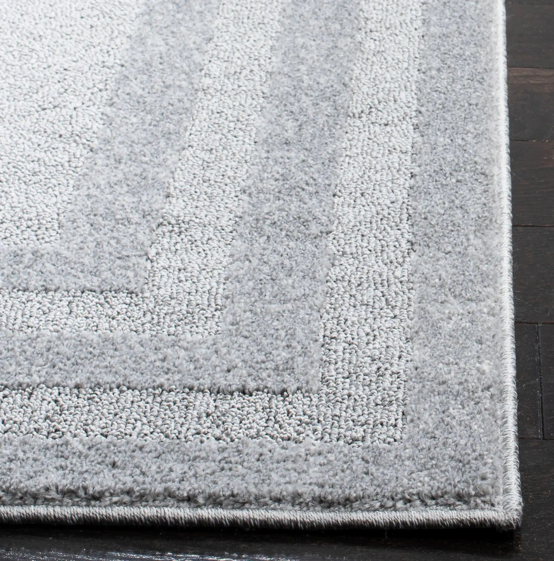 Harbor Concentric Ring Rug in Light Gray / Dark Gray in a styled room